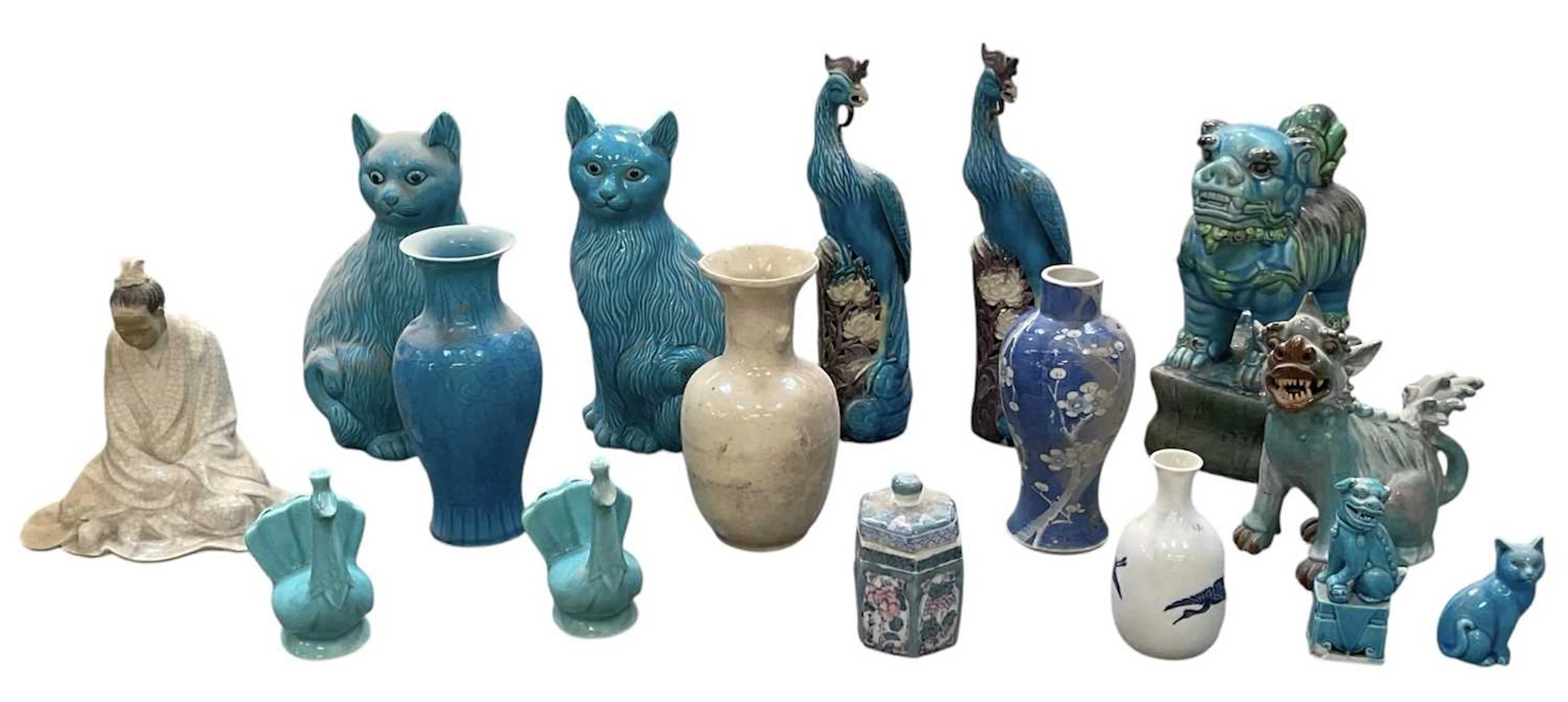 A pair of modern turquoise glazed figures of seated cats