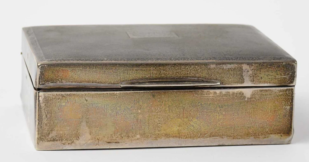 A small Elizabeth II hallmarked silver rectangular cigarette box