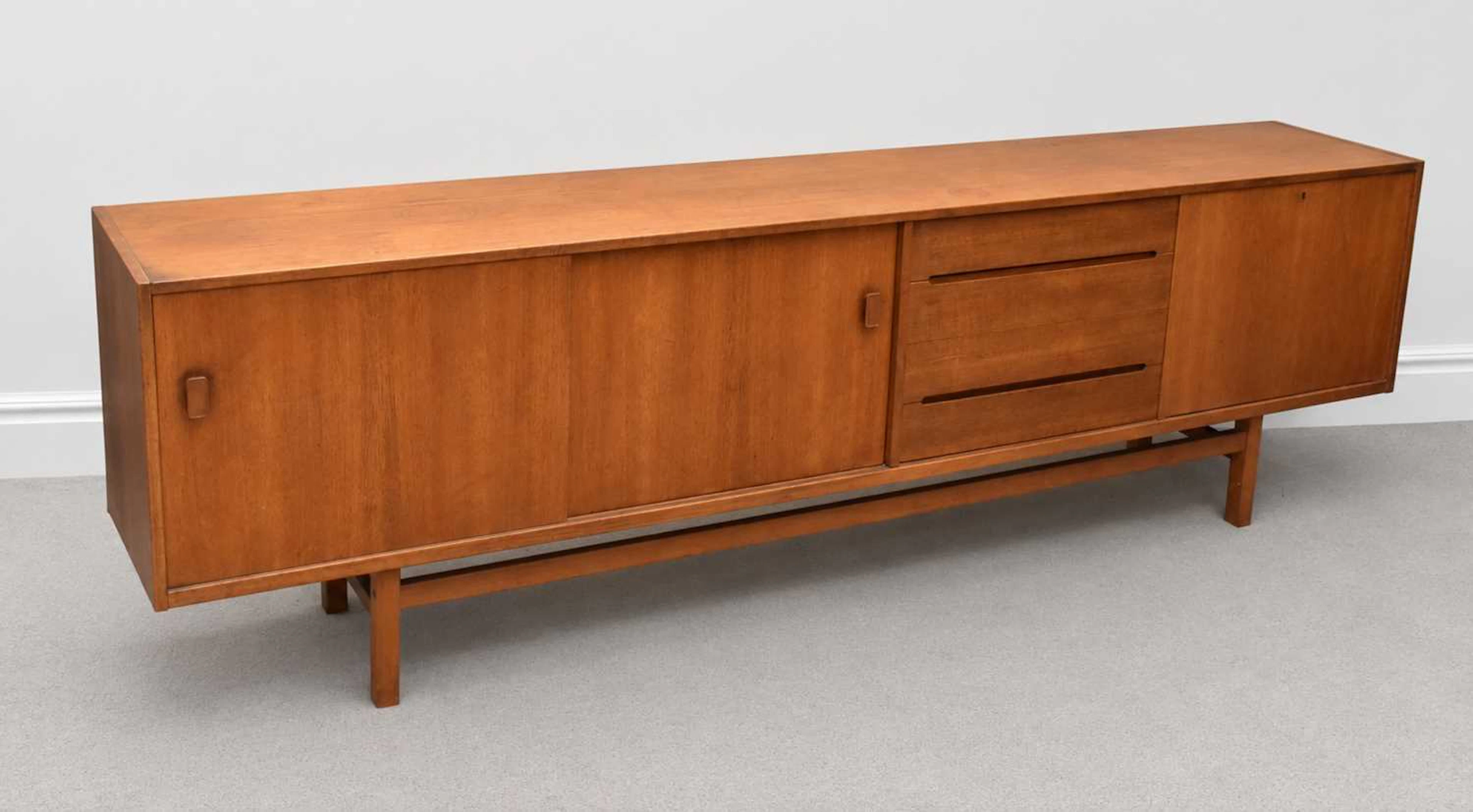 NILS JONSSON; a Swedish teak sideboard with two sliding...