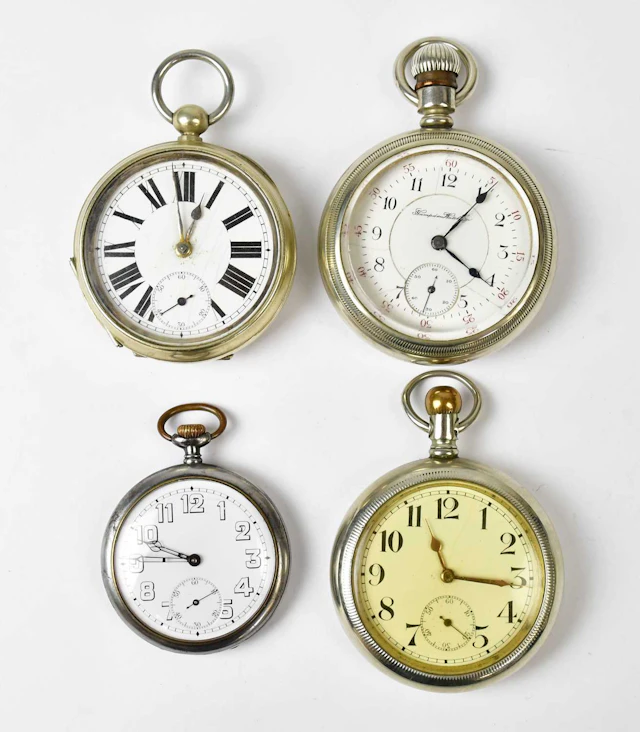 Four silver-plated open face crown and key wind pocket watches