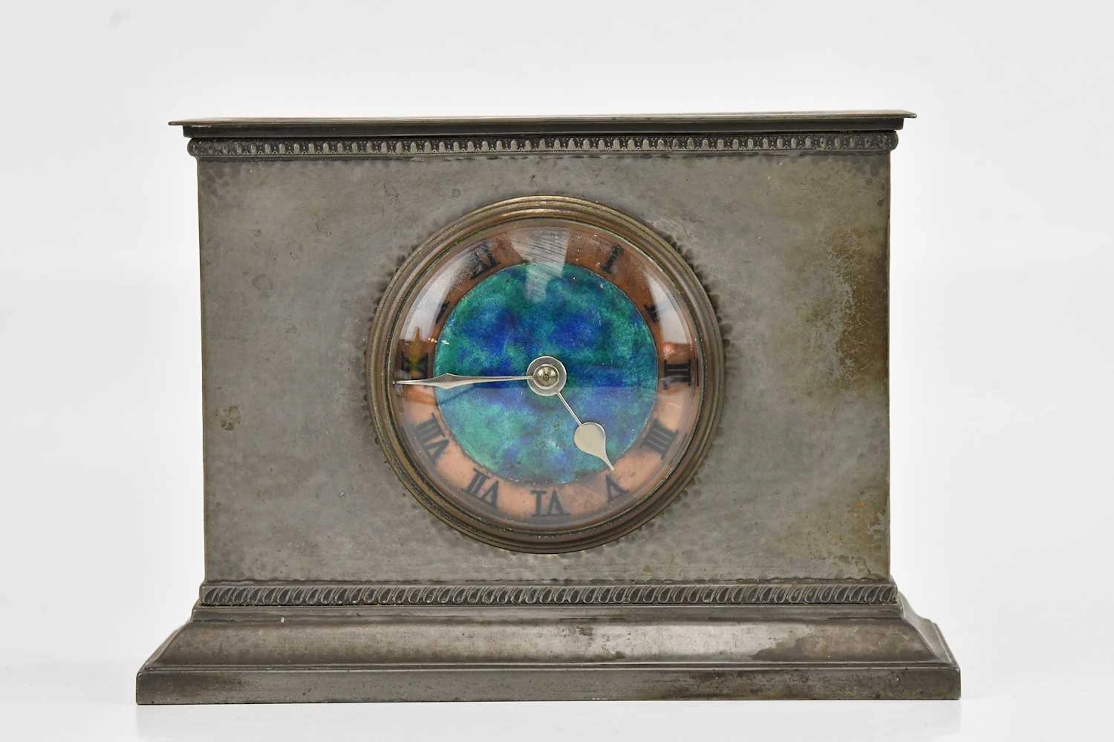 ARCHIBALD KNOX FOR TUDRIC; a pewter eight day mantel timepiece