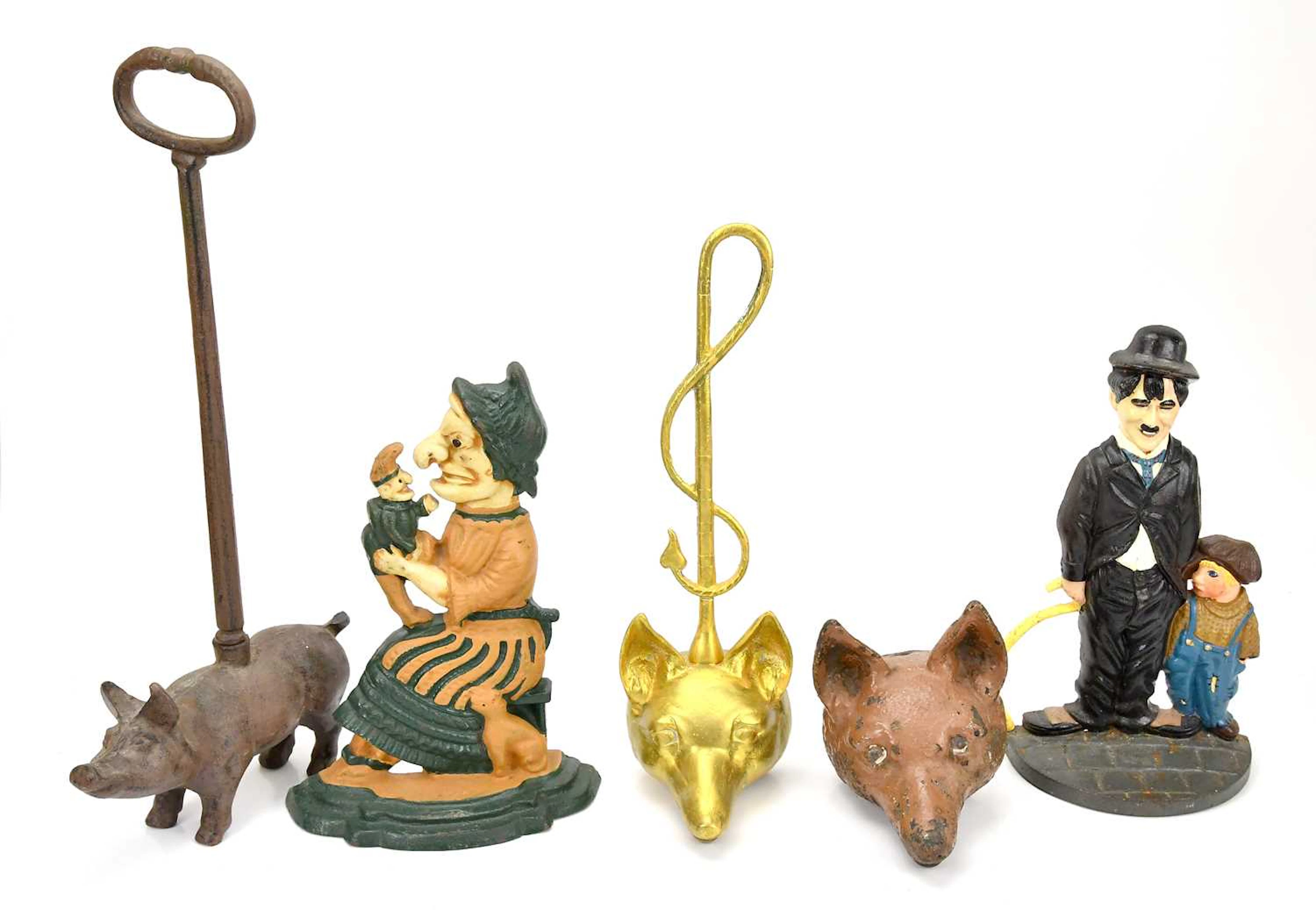 A collection of doorstops including two fox head examples