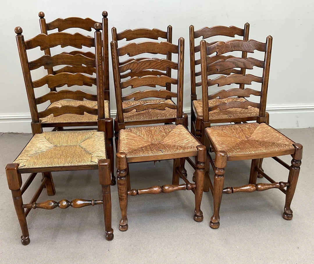 A near set of six oak ladderback country chairs