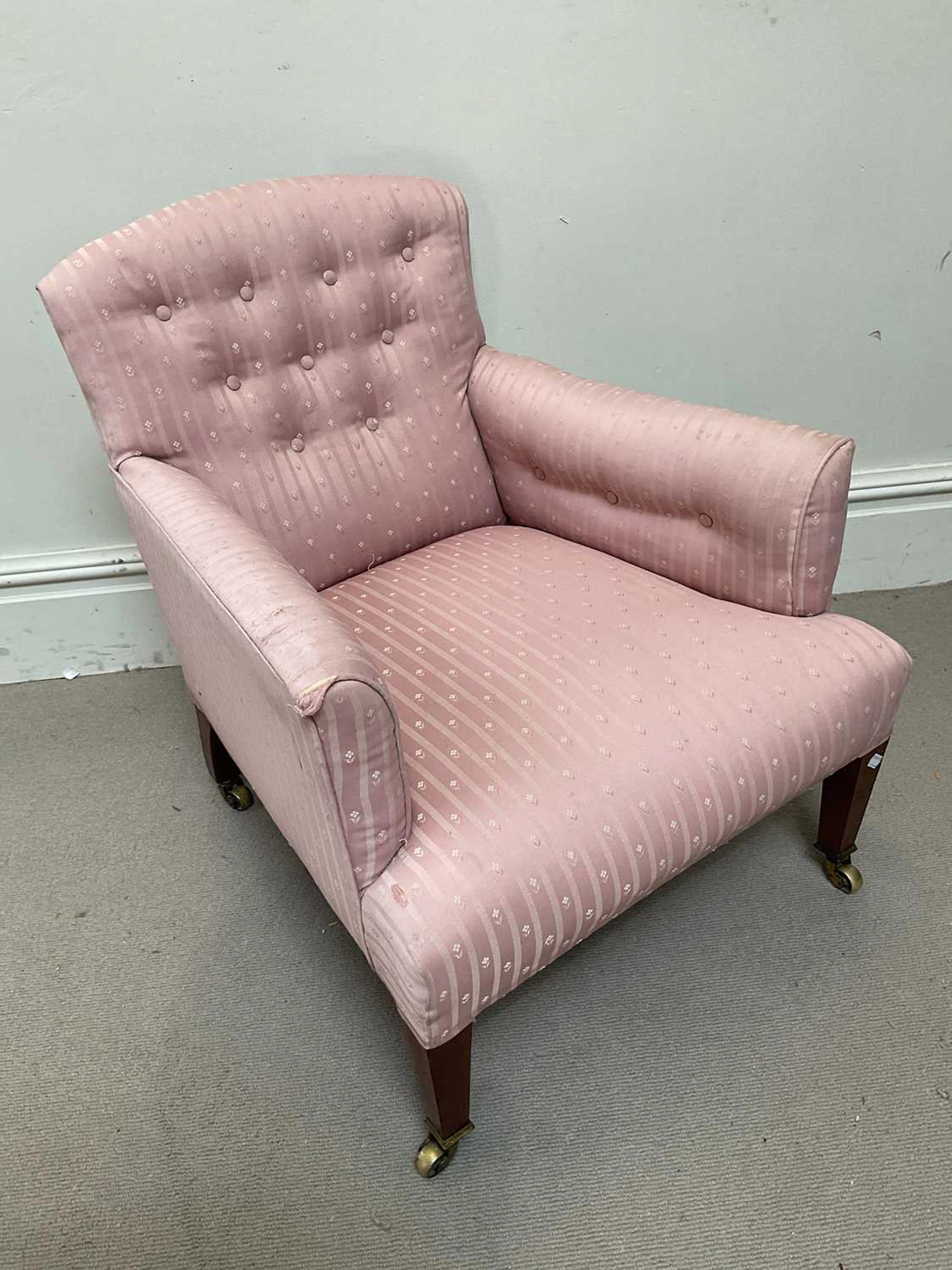 A 19th century armchair in the style of Howard & Sons