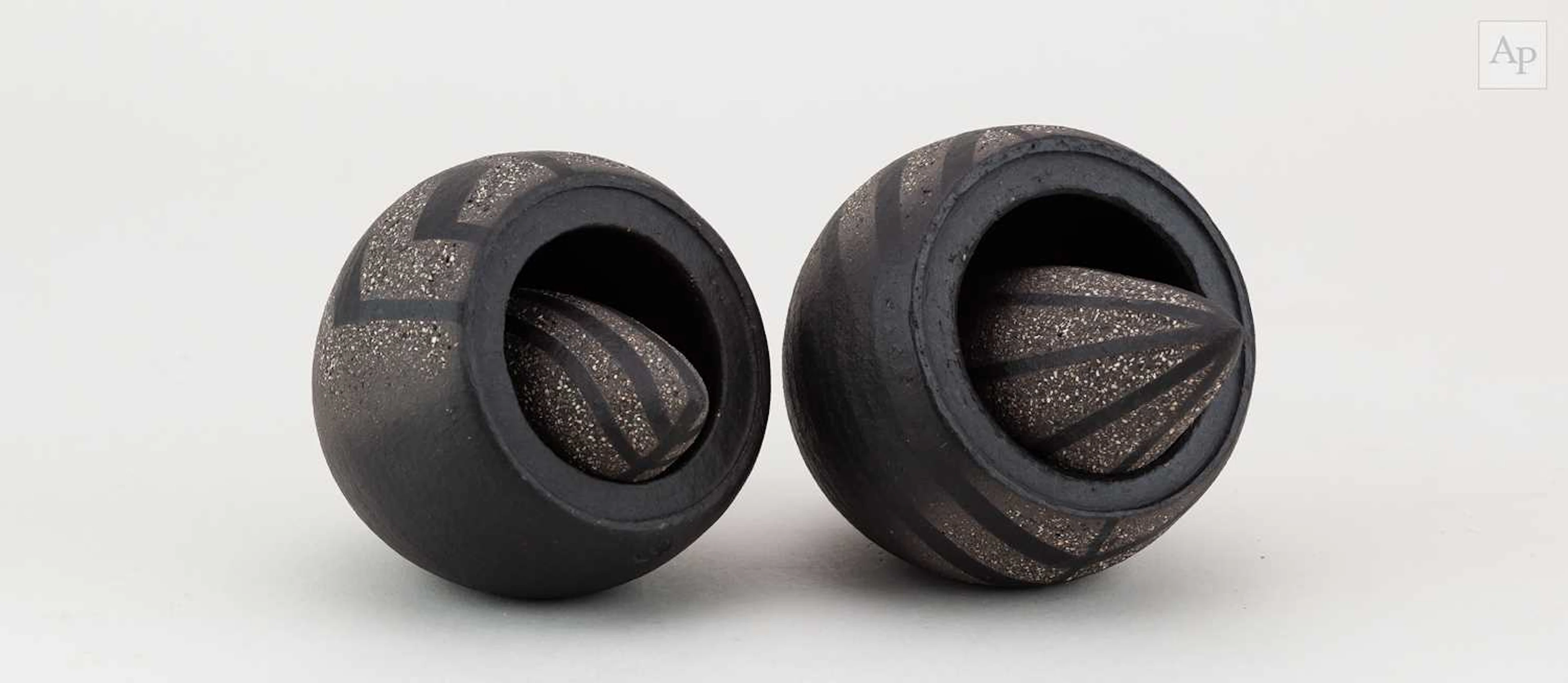 ERIC MOSS (born 1959); a pair of grogged black stoneware...