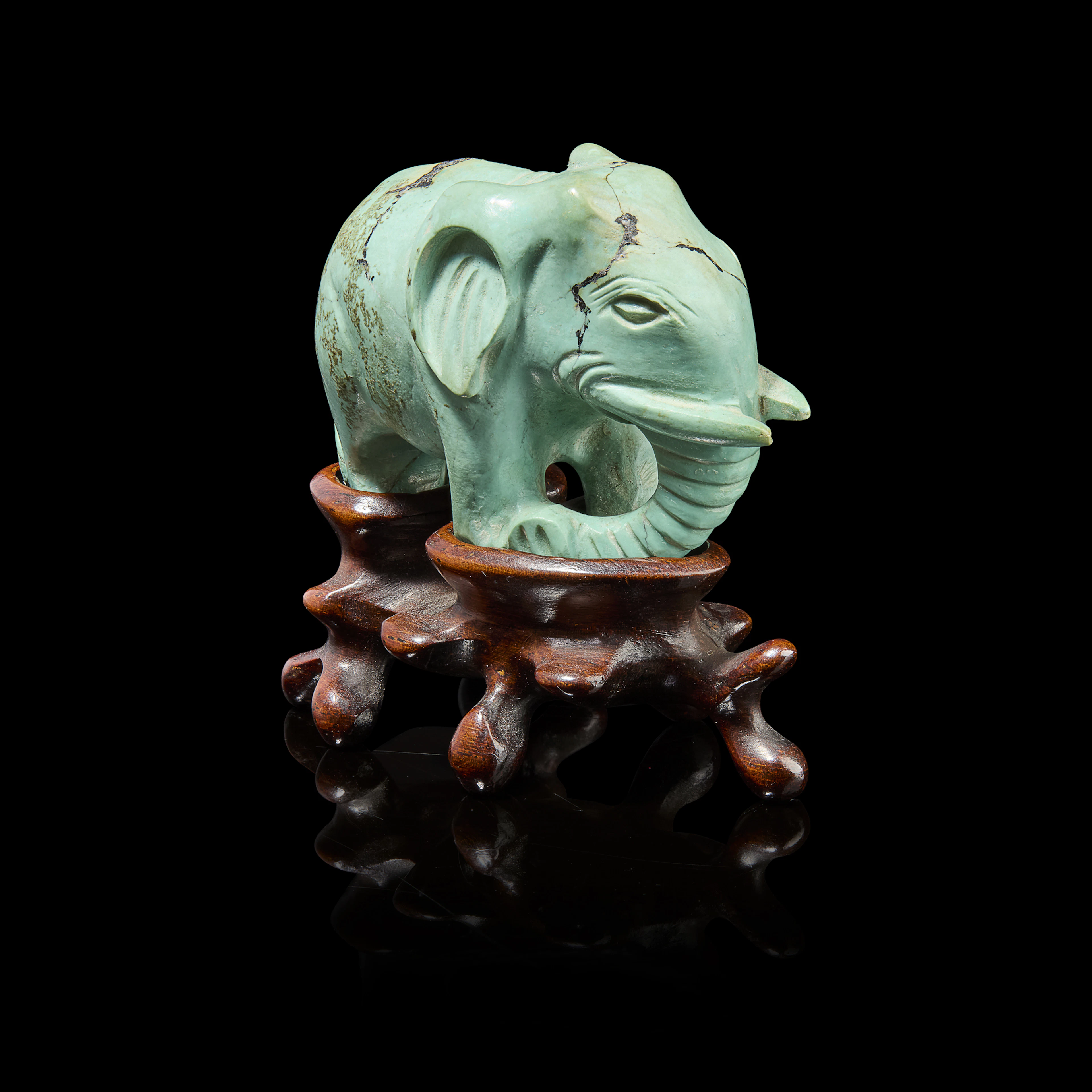 CHINESE TURQUOISE MATRIX CARVING OF AN ELEPHANT