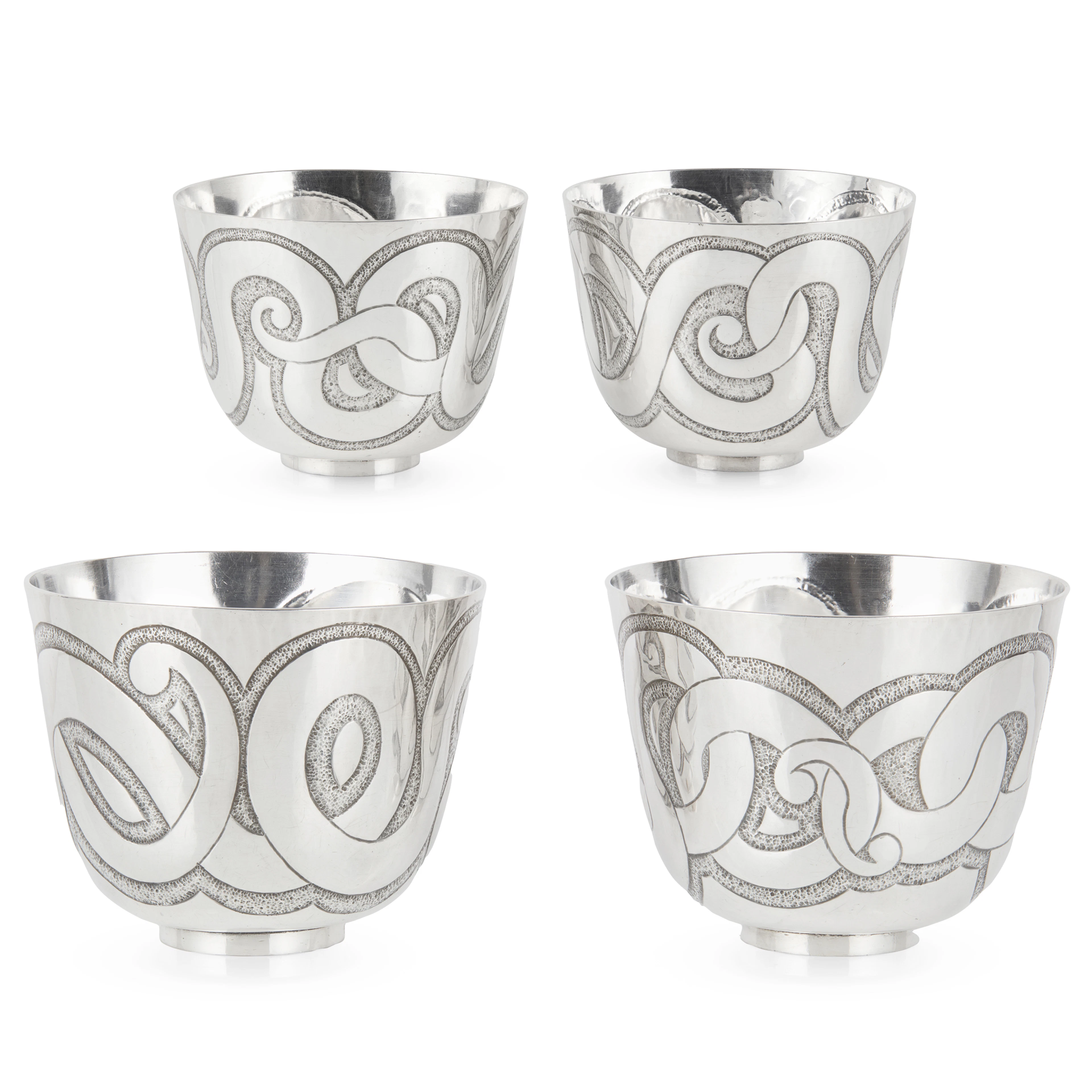 A SET OF FOUR 1990s NEO-CELTIC BEAKERS