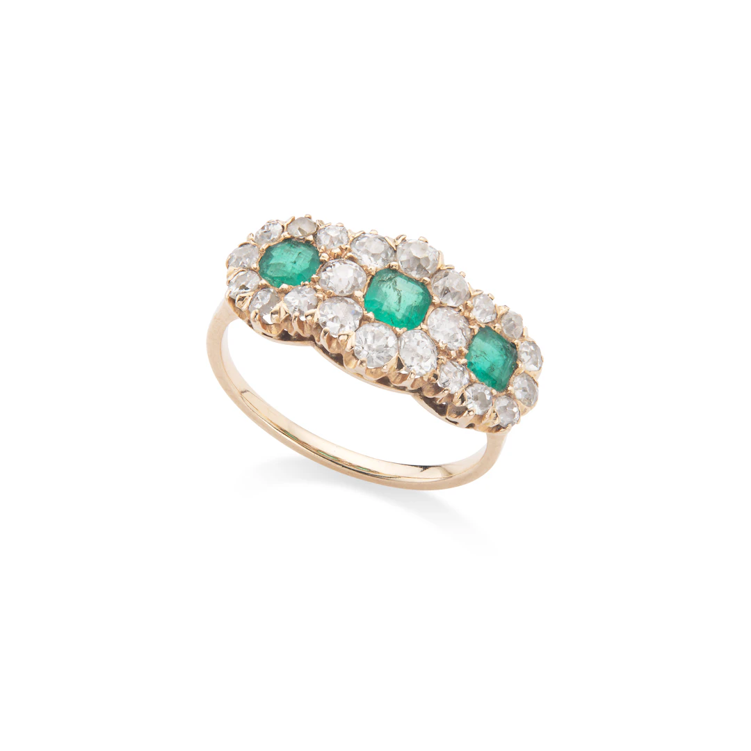 An emerald and diamond triple cluster ring