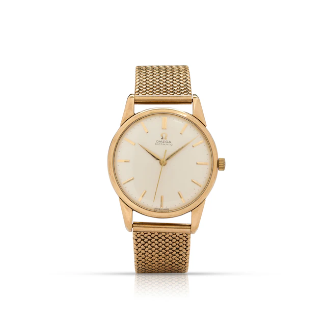 Omega. A 9k gold automatic wristwatch on an associated 9k gold bracelet