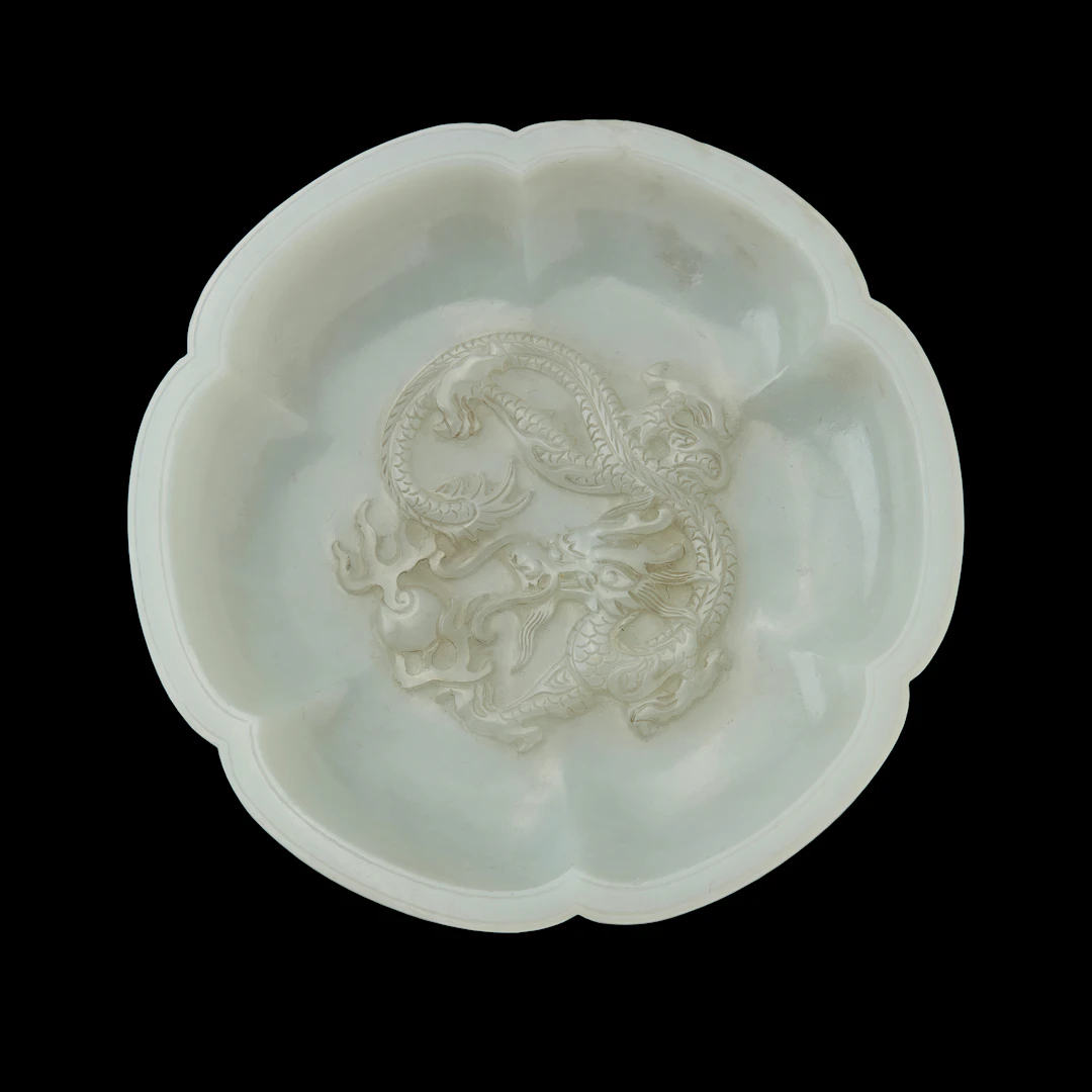 CHINESE WHITE JADE 'DRAGON' FOLIATE SAUCER