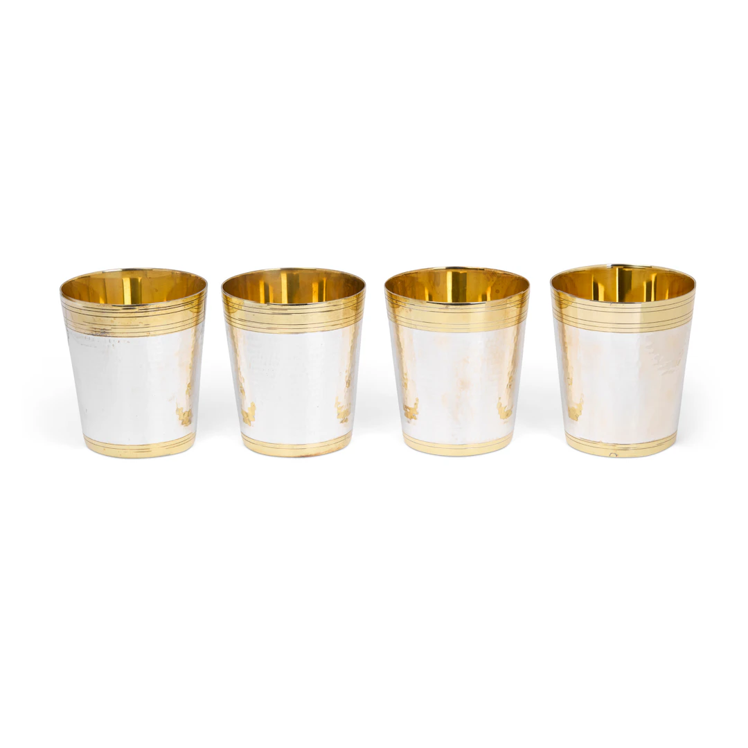 SET OF FOUR CONTEMPORARY SILVER PARCEL-GILT PLANISHED BEAKERS