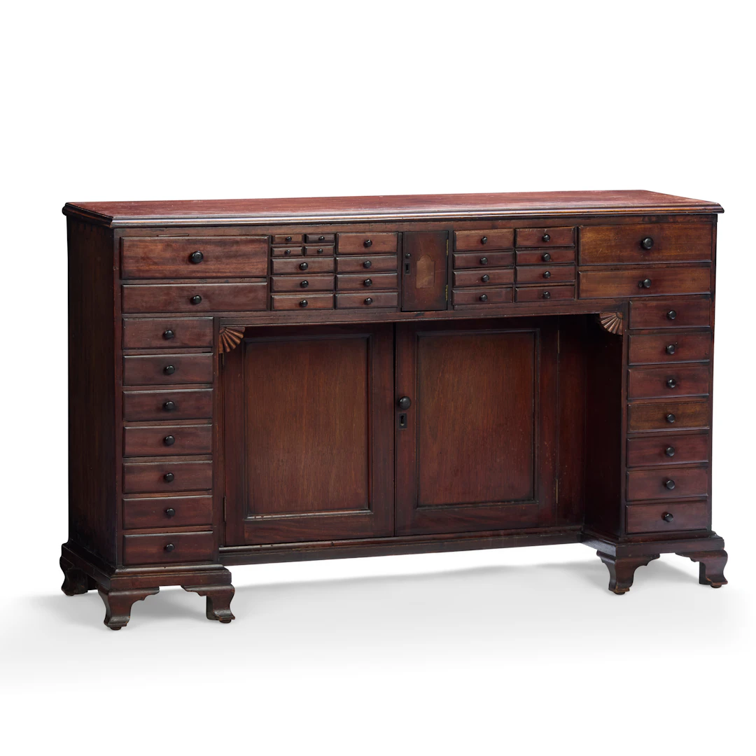 LATE REGENCY MAHOGANY KNEEHOLE COLLECTOR'S CABINET