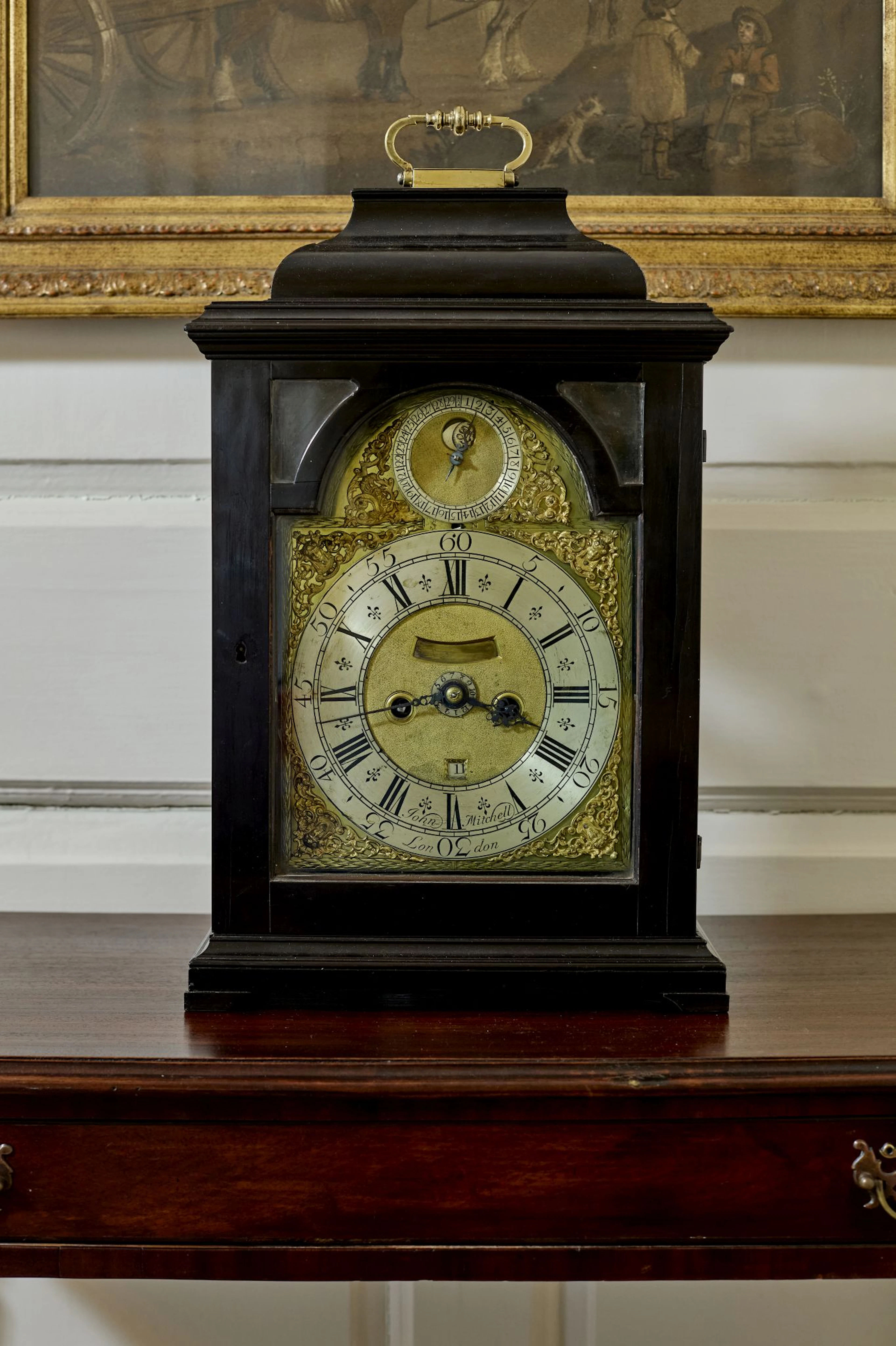 GEORGE II EBONY AND EBONISED BRACKET CLOCK WITH PENNY MOON, JOHN MITCHELL
