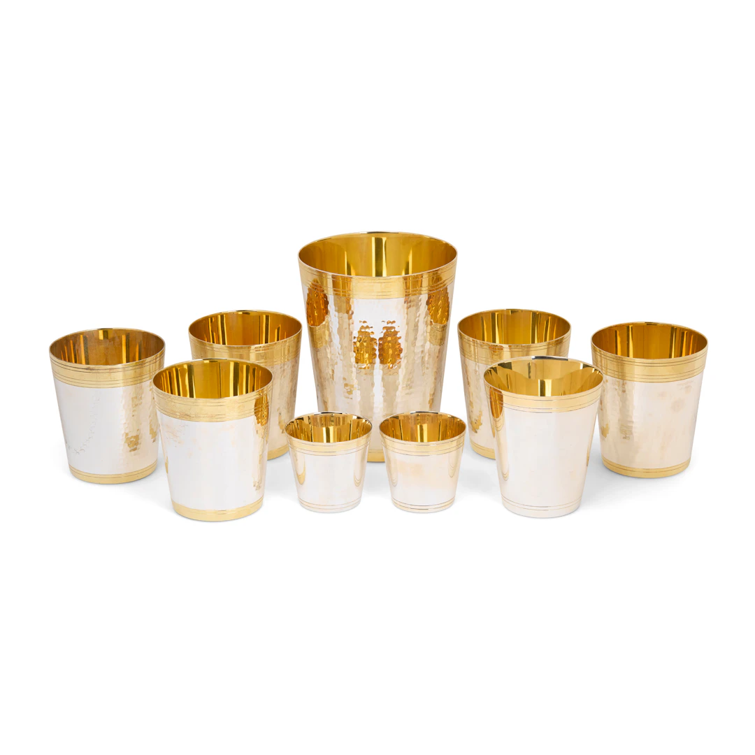 GRADUATED SET OF CONTEMPORARY SILVER PARCEL-GILT PLANISHED BEAKERS