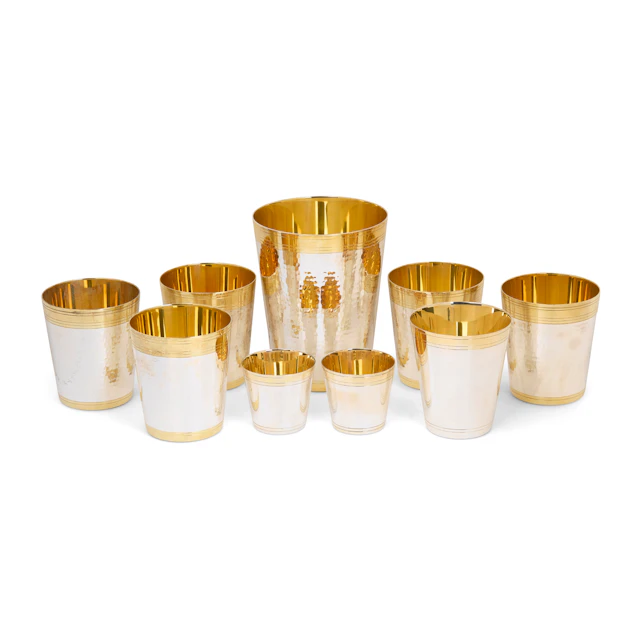 GRADUATED SET OF CONTEMPORARY SILVER PARCEL-GILT PLANISHED BEAKERS