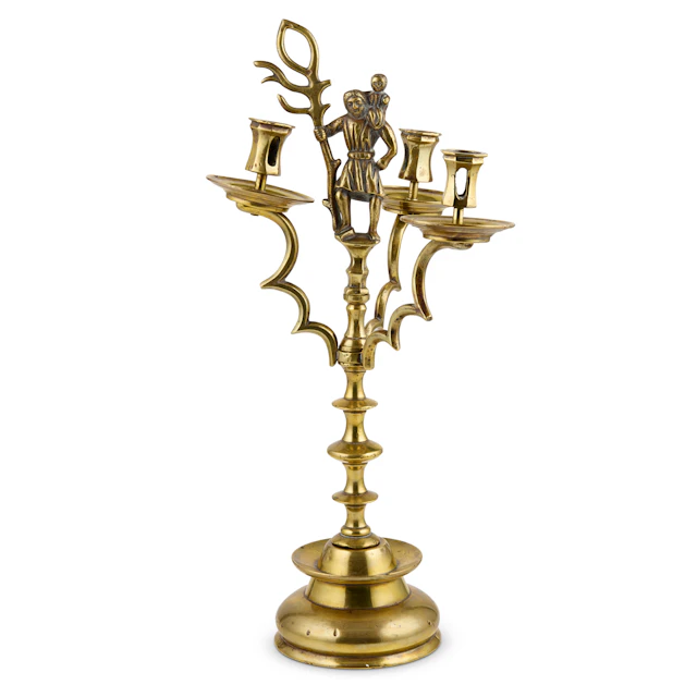 GERMAN BRASS THREE BRANCH 'SAINT CHRISTOPHER' CANDLESTICK