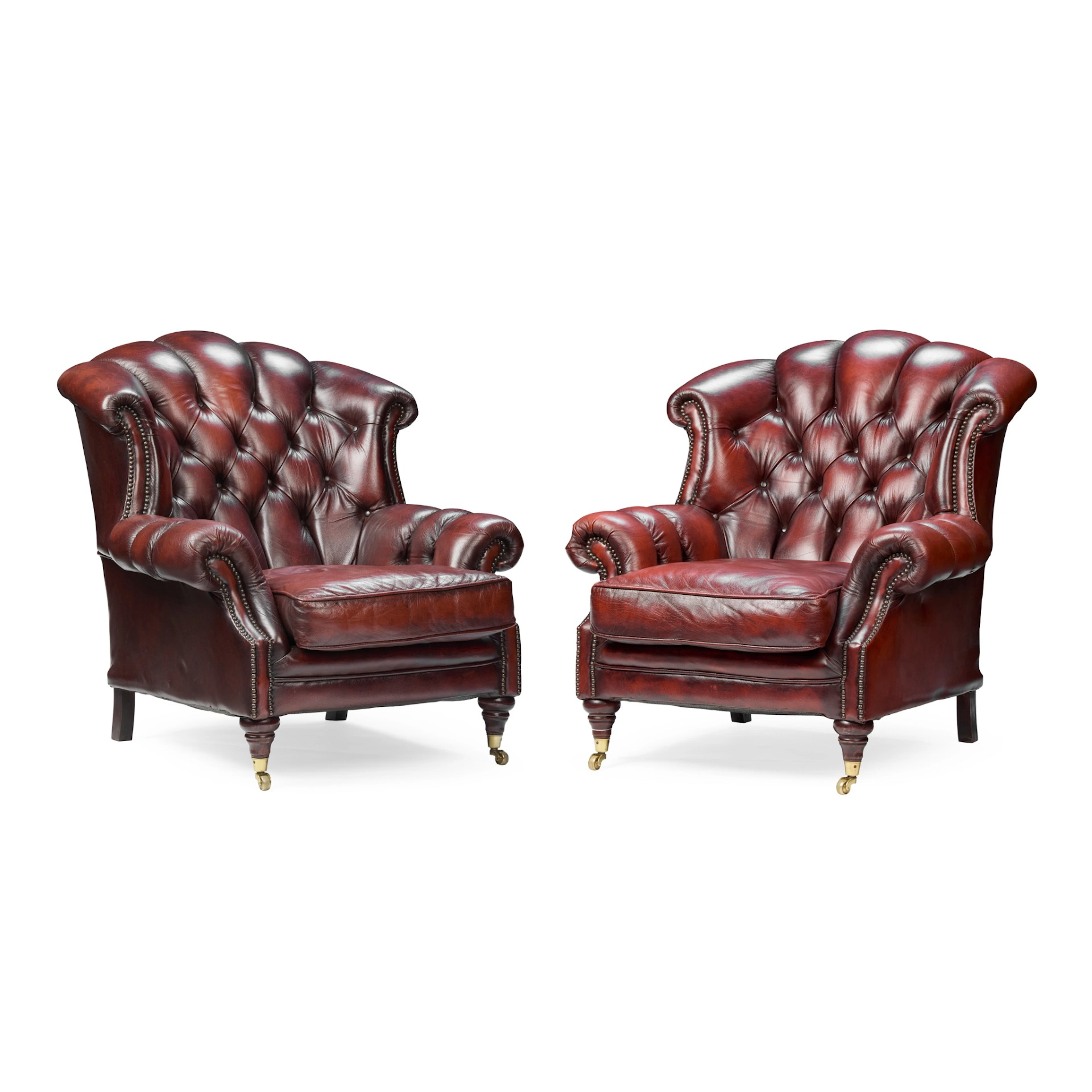 A PAIR OF BUTTONED LEATHER CLUB ARMCHAIRS