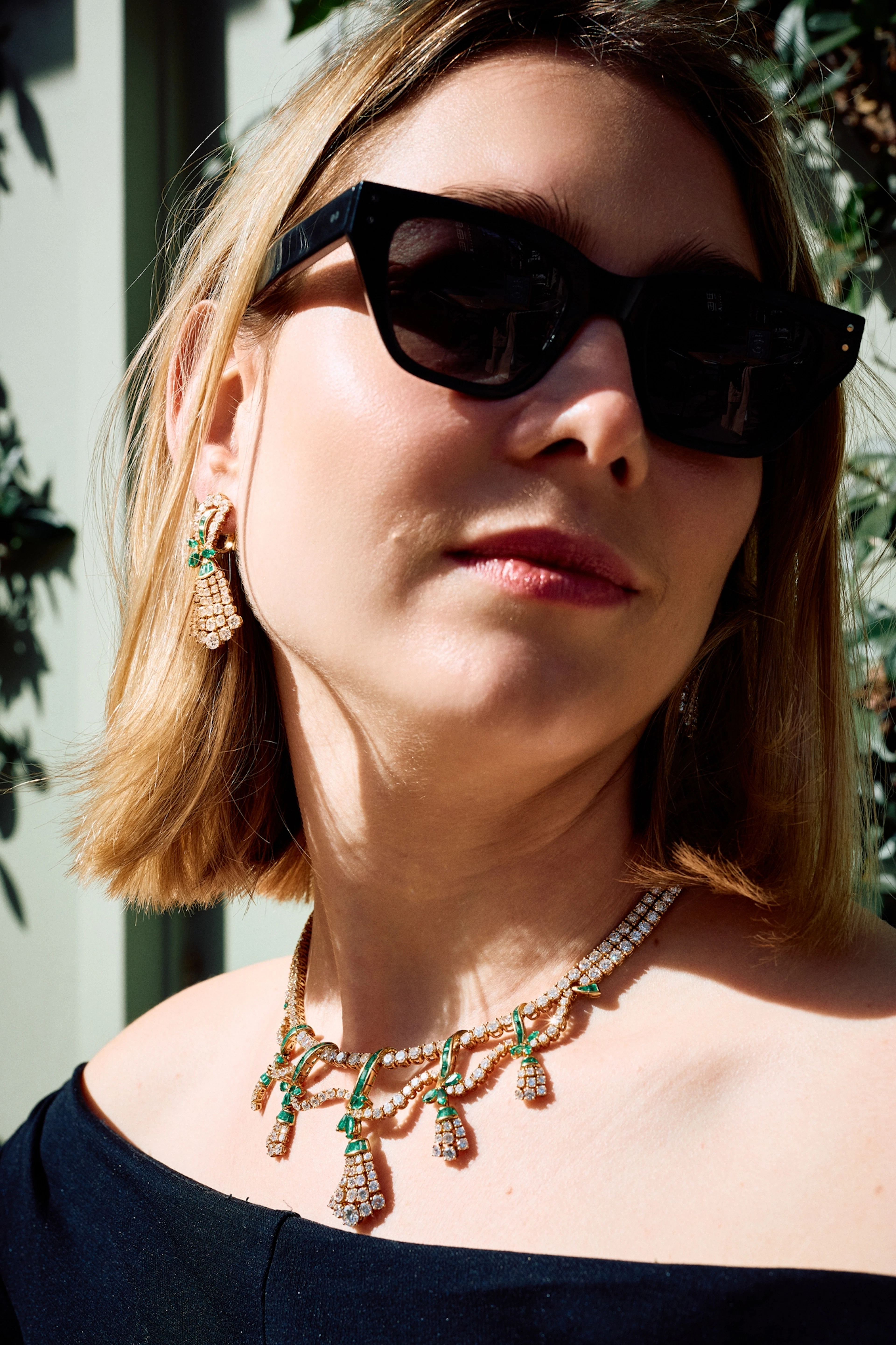 An emerald and diamond swag necklace