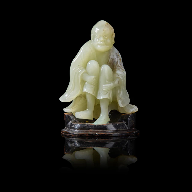 CHINESE WHITE JADE WITH RUSSET INCLUSIONS CARVING OF ARHAT