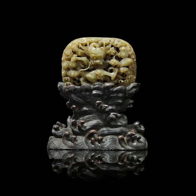 [COLLECTION OF A BRITISH FAMILY] CHINESE WHITE JADE WITH RUSSET INCLUSIONS