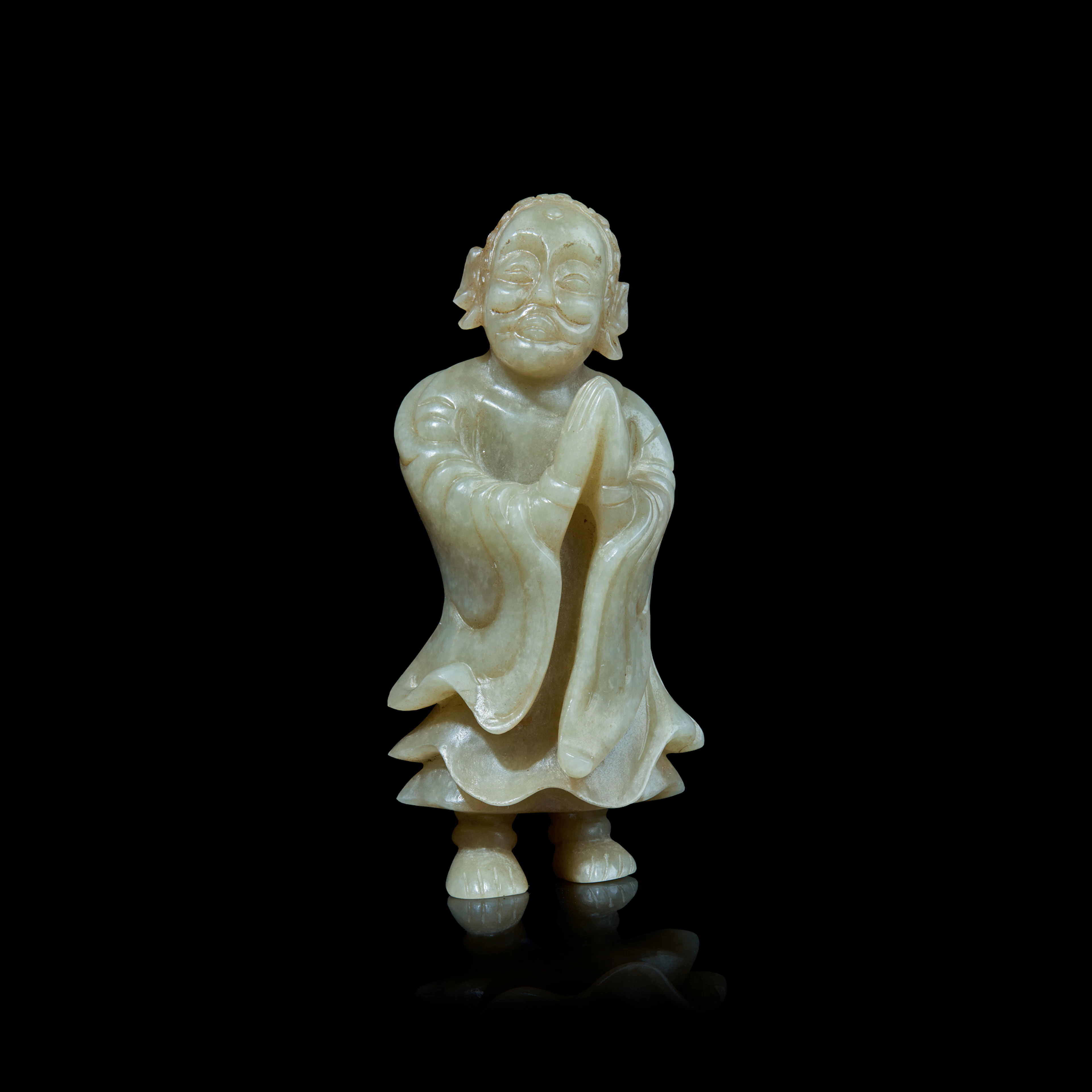 CHINESE PALE CELADON JADE CARVING OF A PRAYING ARHAT