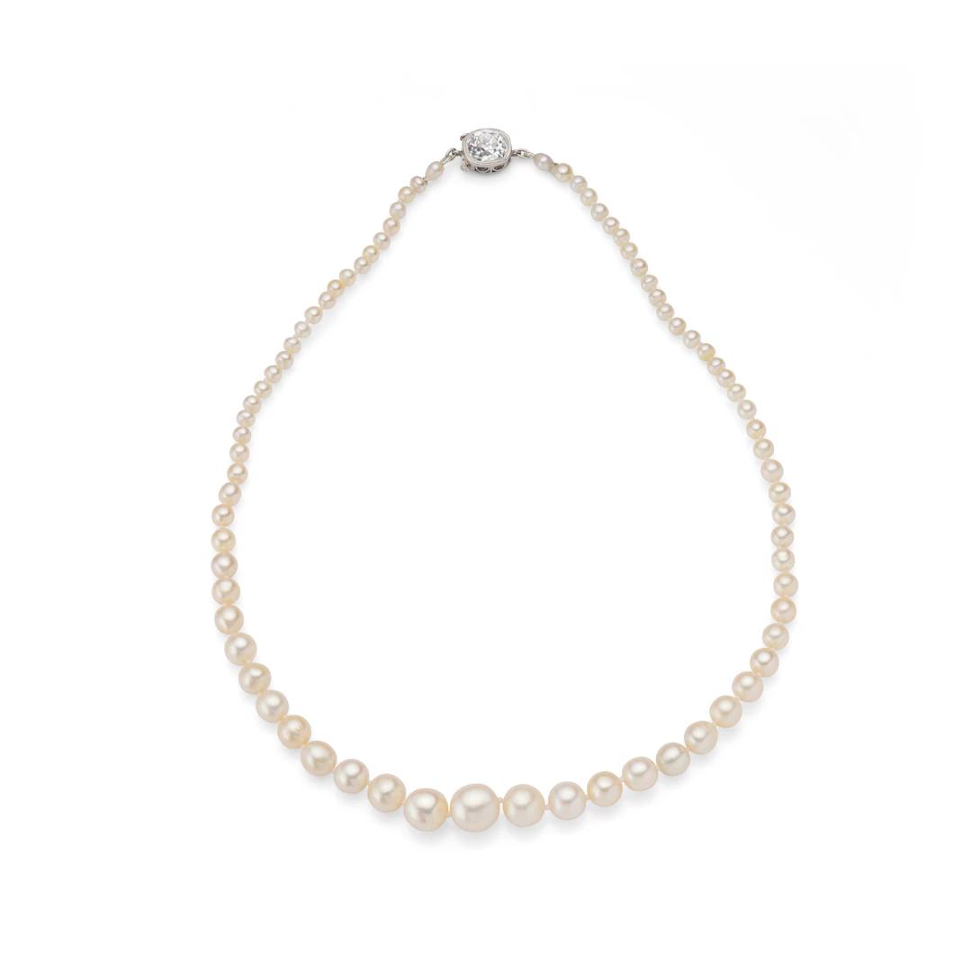 A natural pearl necklace with a diamond clasp