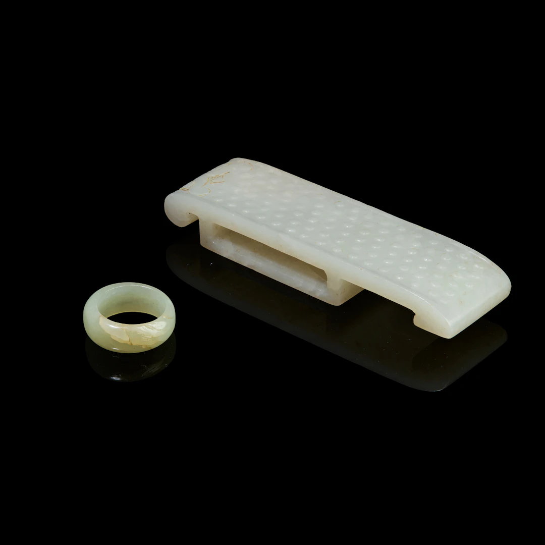CHINESE WHITE JADE SWORD SLIDE AND PALE CELADON JADE RING