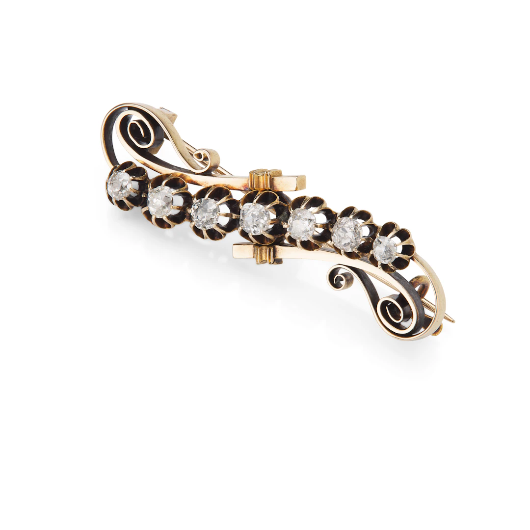 A cushion-shaped diamond brooch