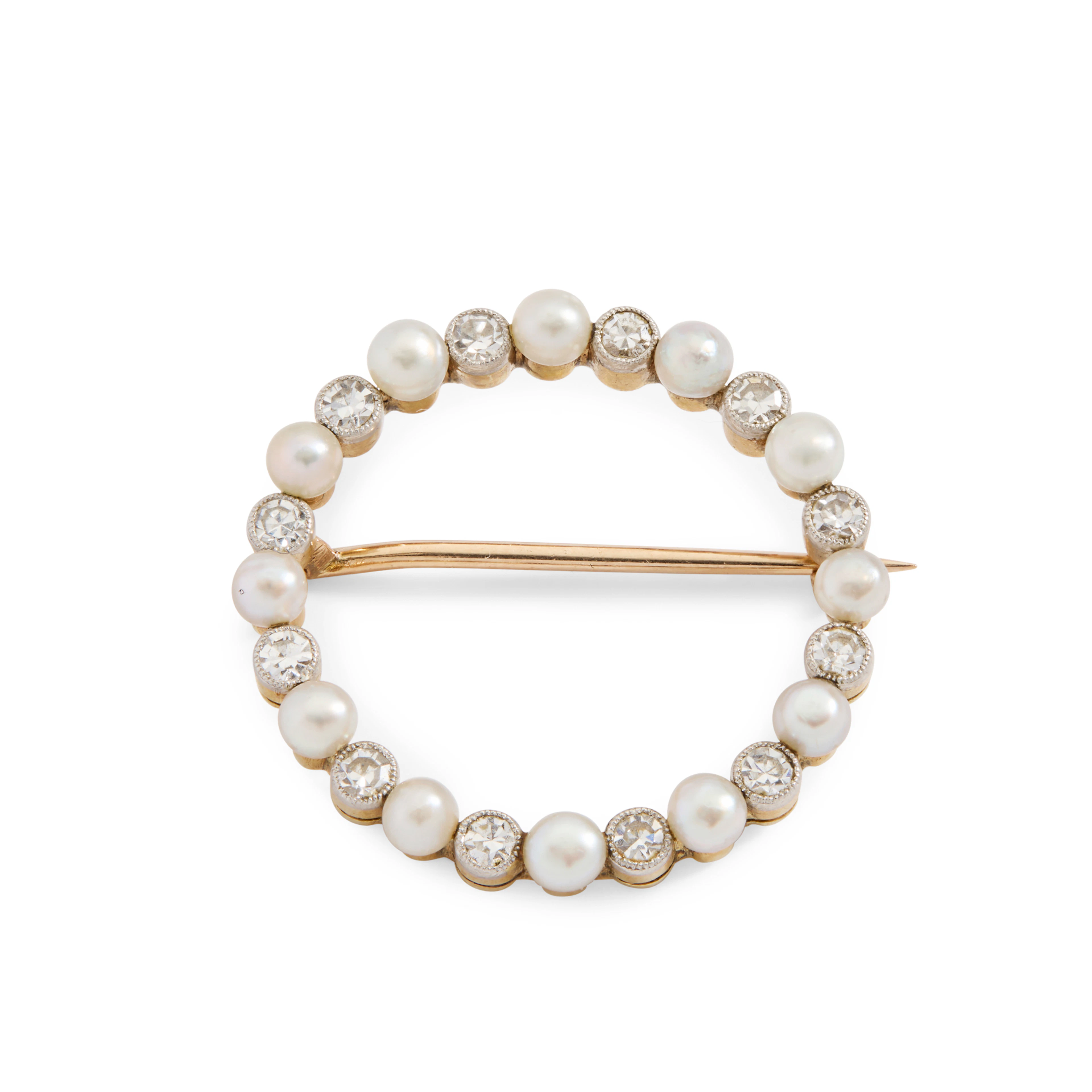 An early 20th century diamond and pearl brooch