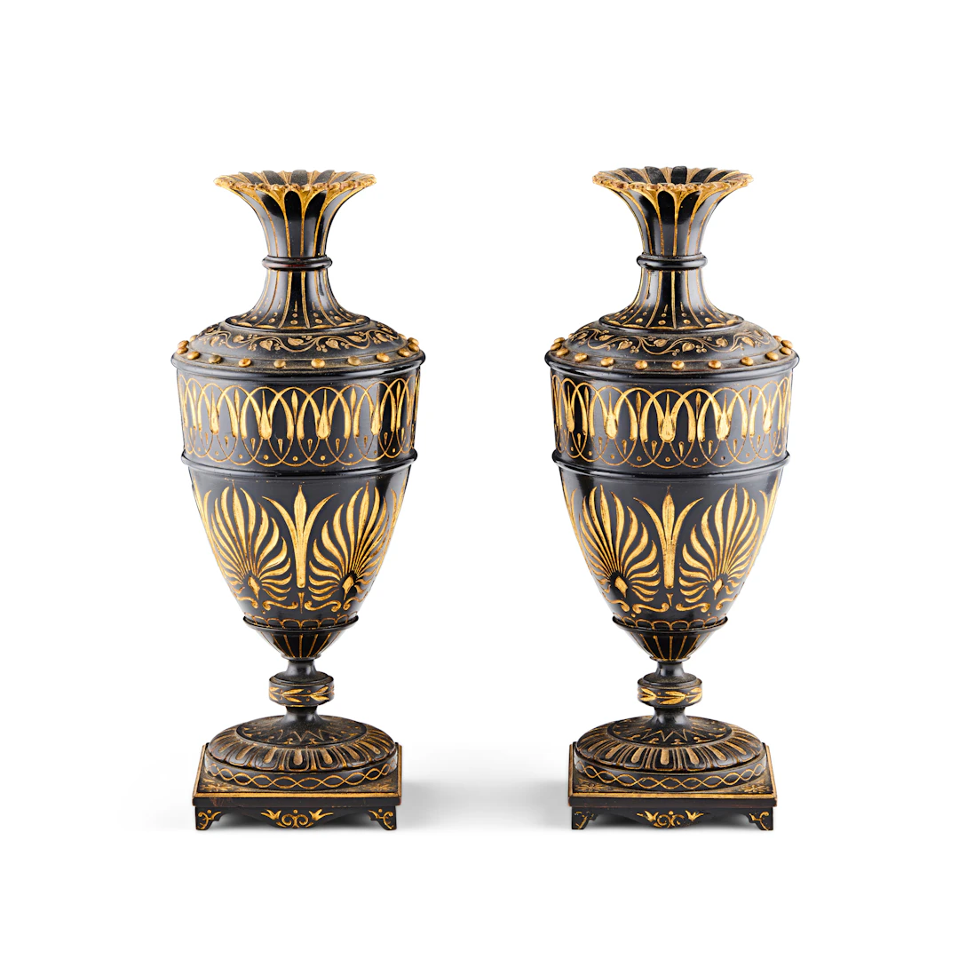 PAIR OF CARVED AND EBONISED GILT-DECORATED VASES, IN THE MANNER OF THOMAS HOPE