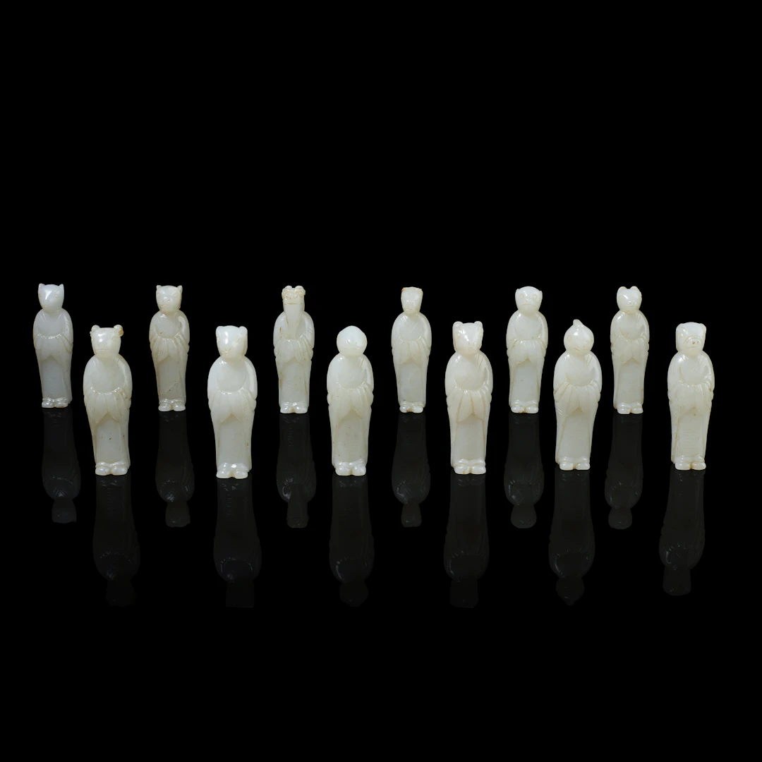 SET OF TWELVE CHINESE WHITE JADE ZODIAC CARVINGS