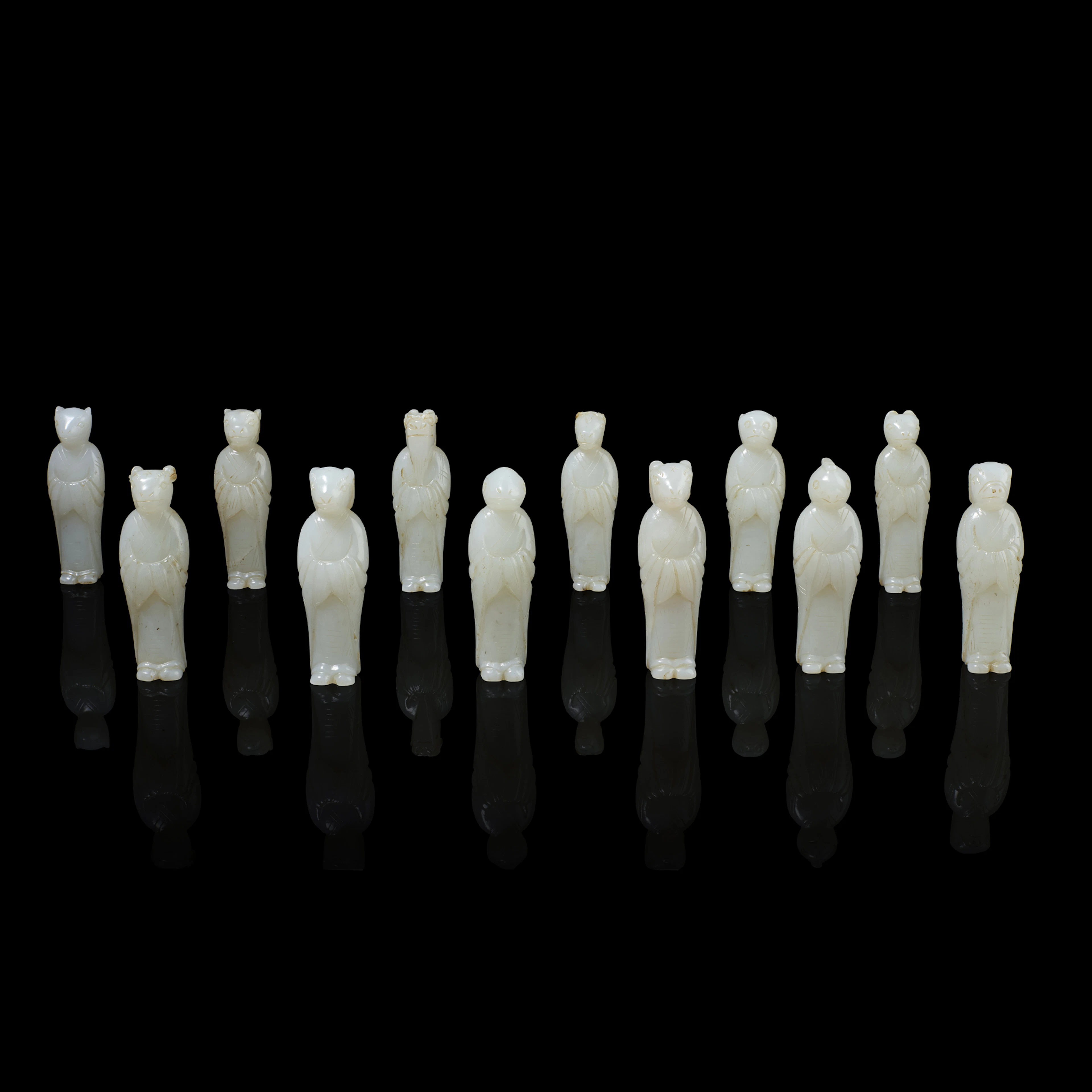 SET OF TWELVE CHINESE WHITE JADE ZODIAC CARVINGS