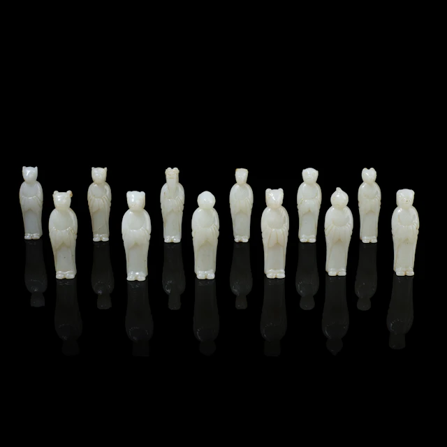 SET OF TWELVE CHINESE WHITE JADE ZODIAC CARVINGS