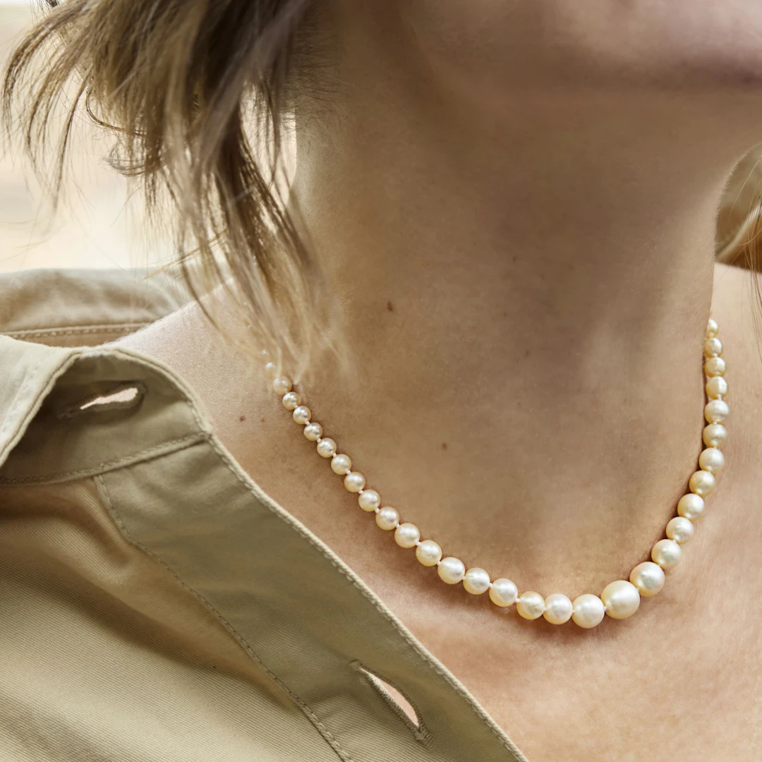A natural pearl necklace with a diamond clasp