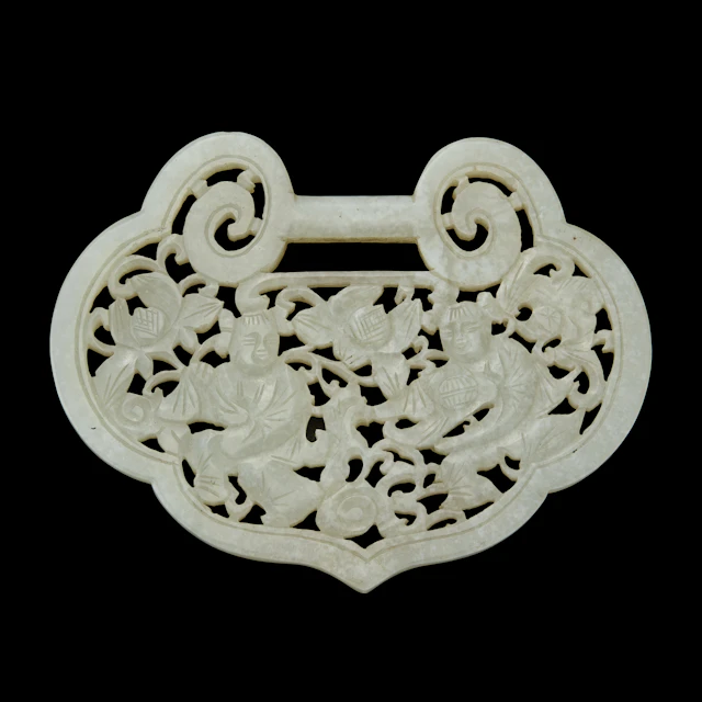 CHINESE RETICULATED WHITE JADE 'HEHE TWINS' RUYI-FORM PENDANT
