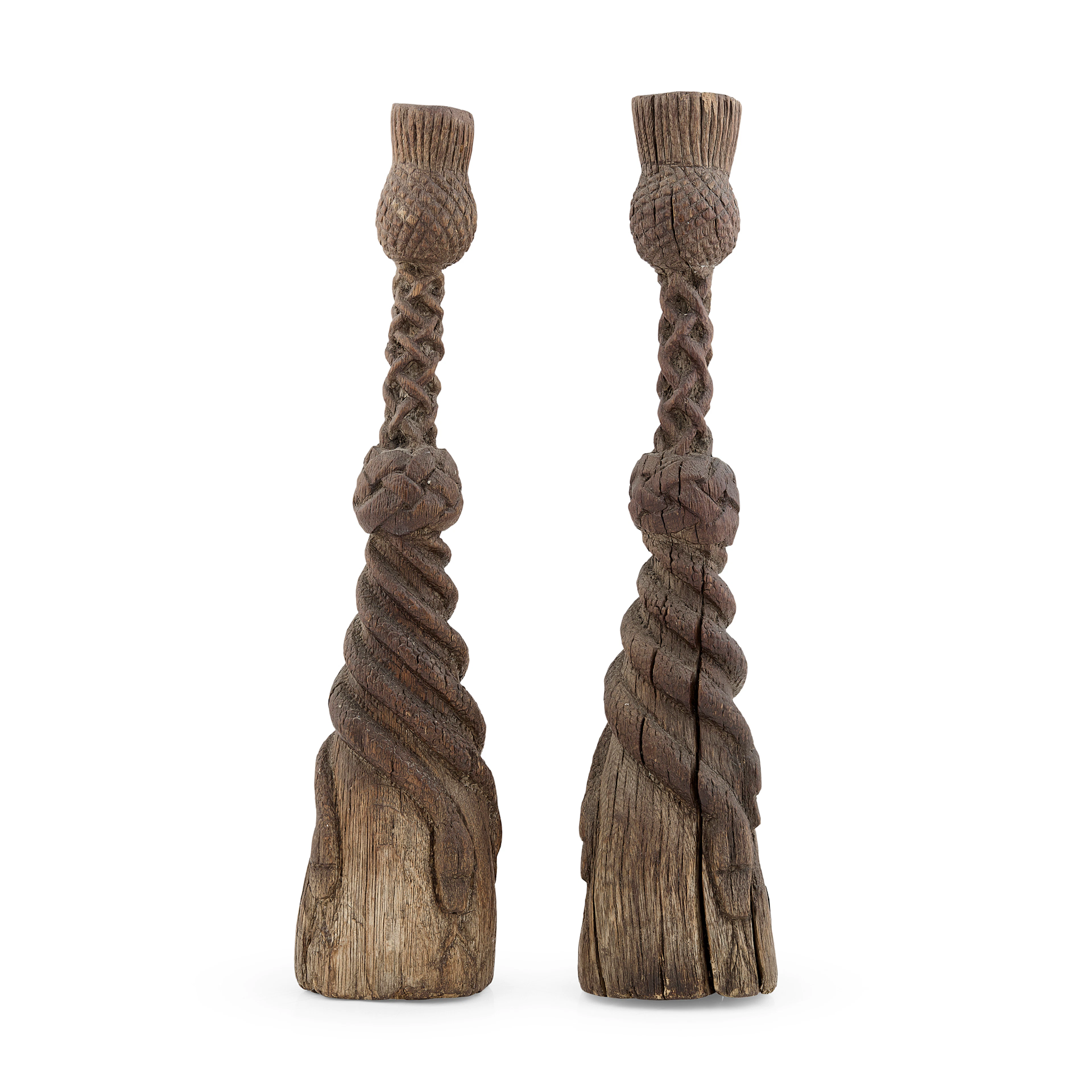 A PAIR OF UNUSUAL CARVED OAK CANDLESTICKS