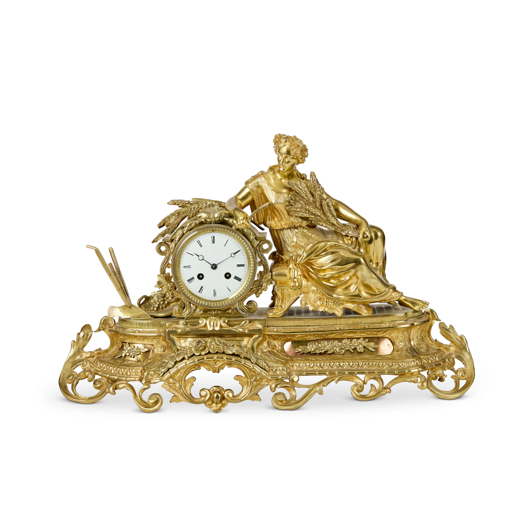 FRENCH GILT BRASS AND BRASS FIGURAL MANTEL CLOCK