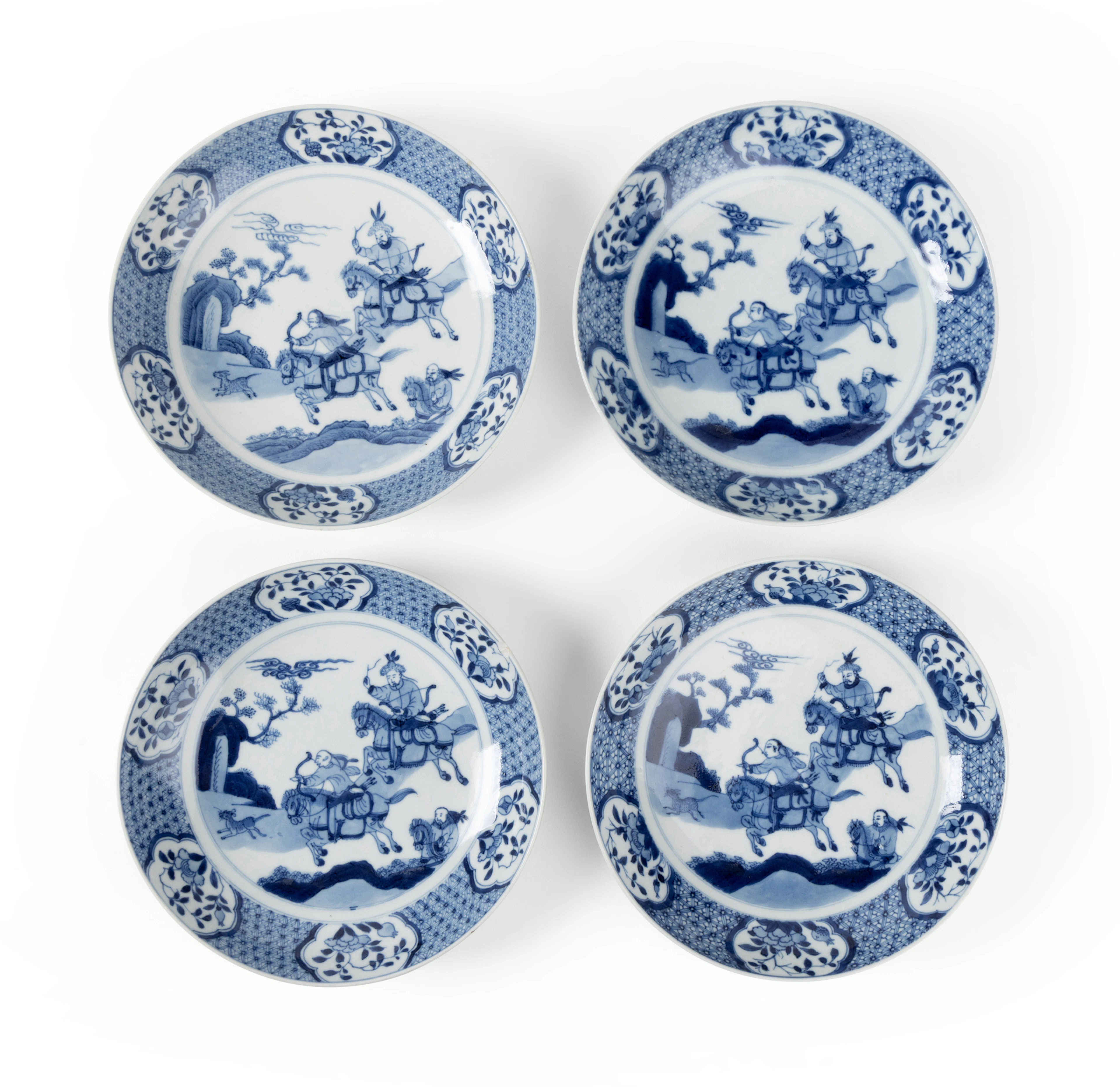 GROUP OF FOUR CHINESE BLUE AND WHITE 'HUNTING SCENE' DEEP DISHES