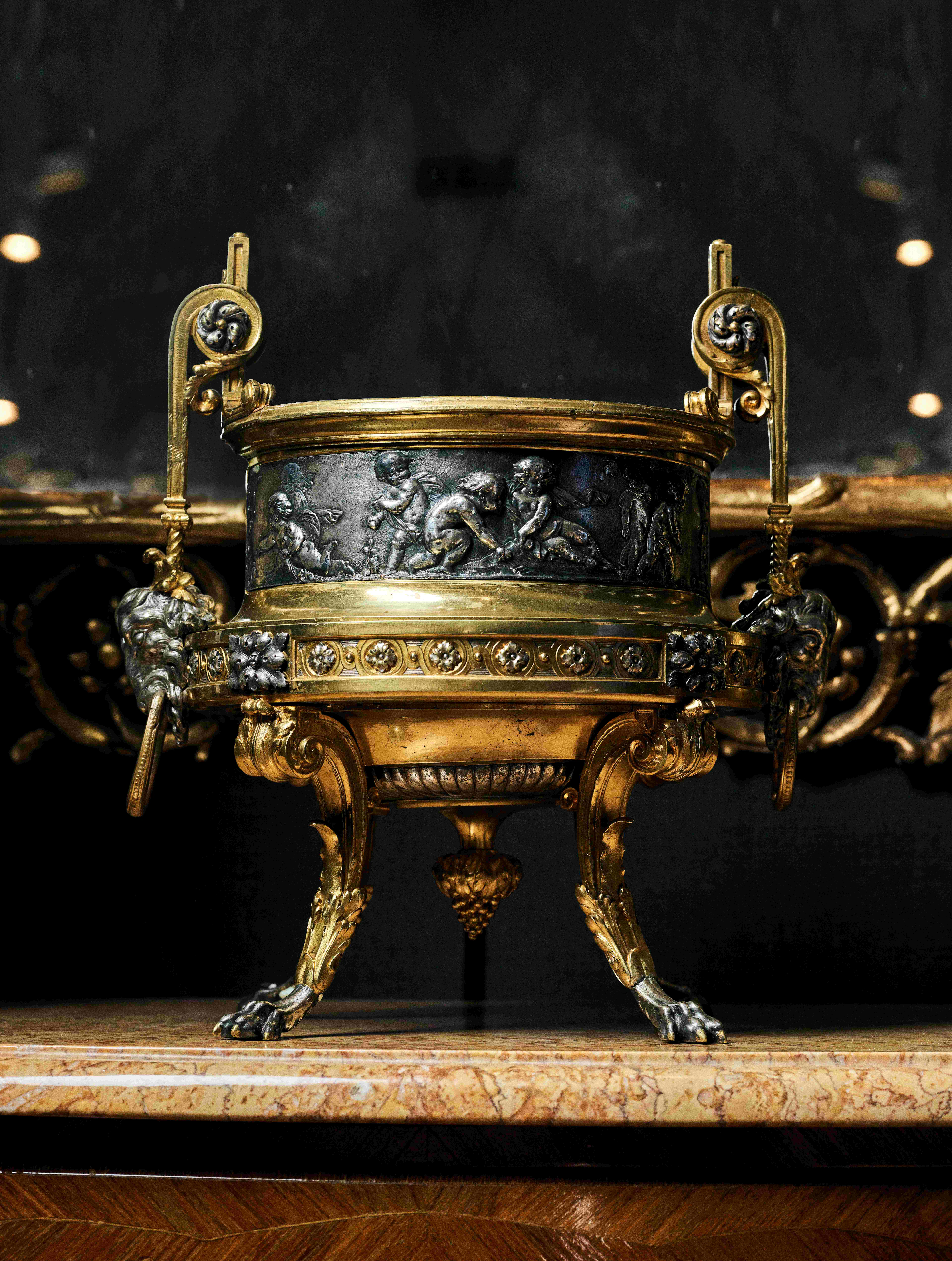 A FRENCH NAPOLEON III SILVERED AND GILT BRONZE JARDINIÈRE