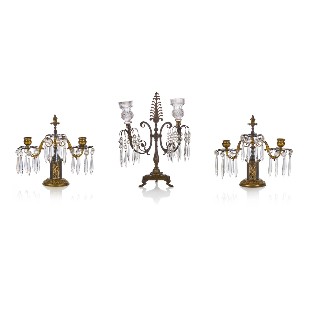 THREE REGENCY BRASS AND CUT GLASS CANDELABRA