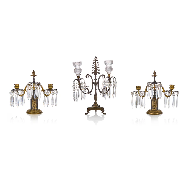 THREE REGENCY BRASS AND CUT GLASS CANDELABRA