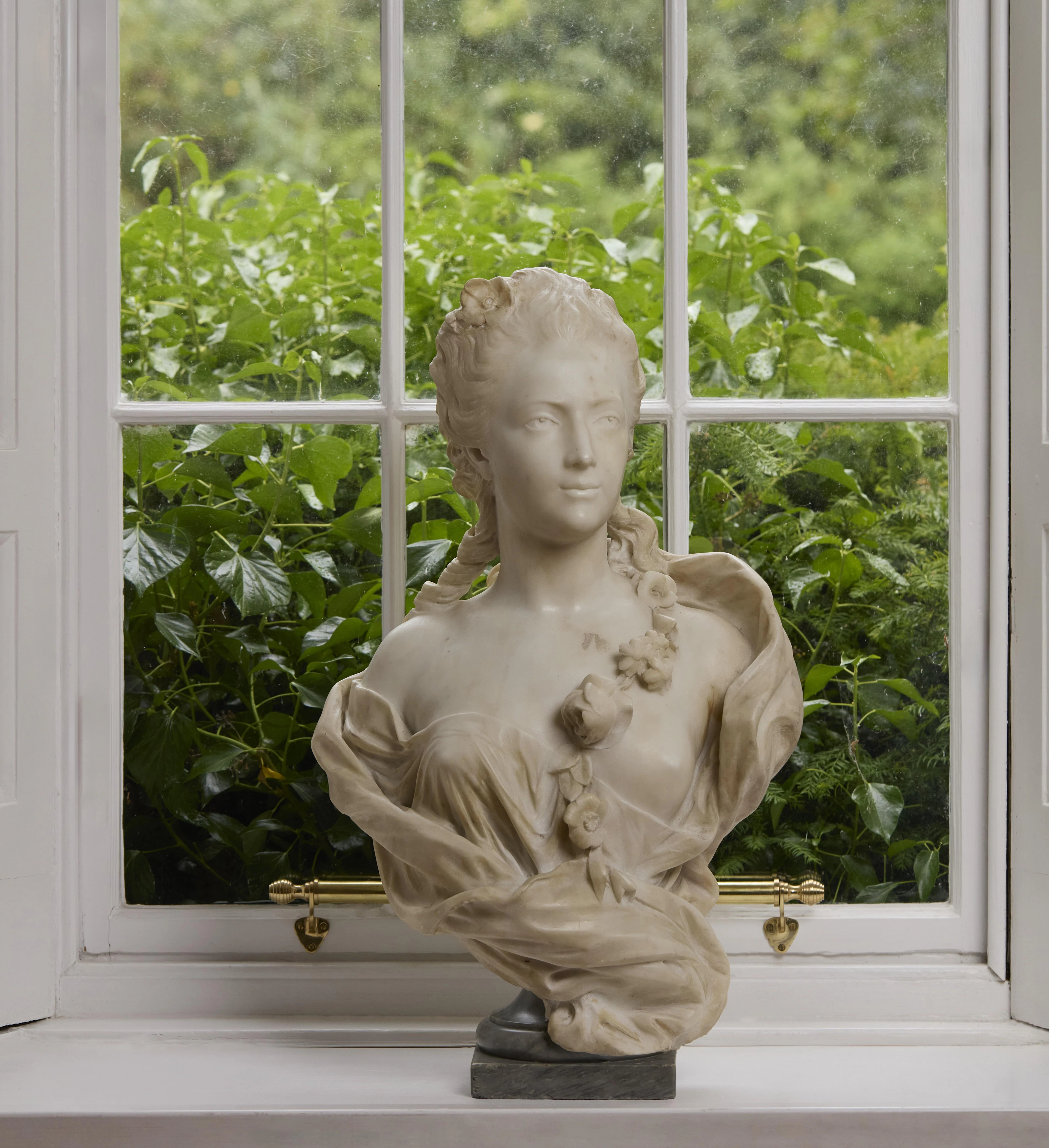 FRENCH WHITE MARBLE BUST OF A YOUNG LADY, IN THE MANNER OF HOUDON