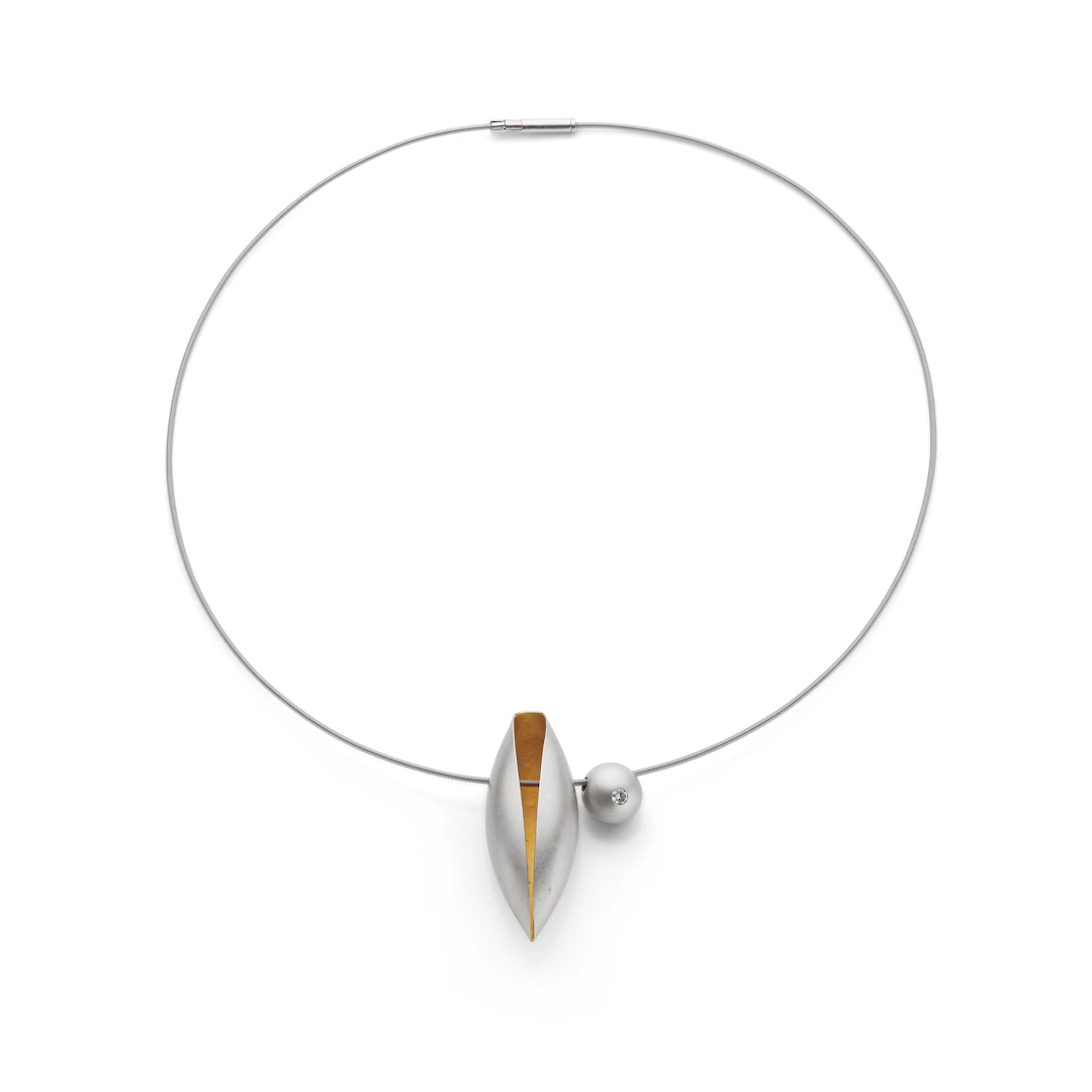 Niessing: A cord necklace with two pendants