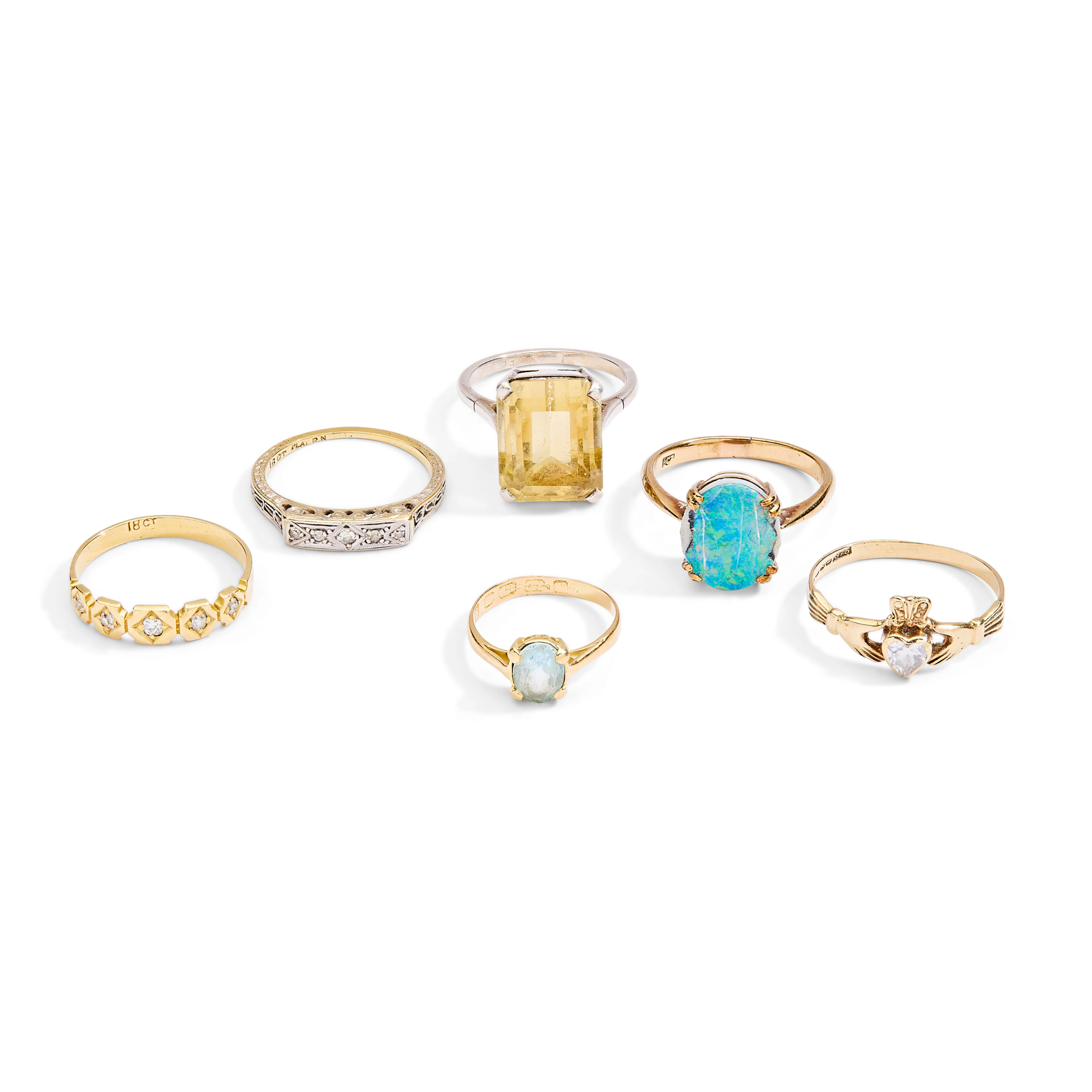 A collection of six gem-set rings