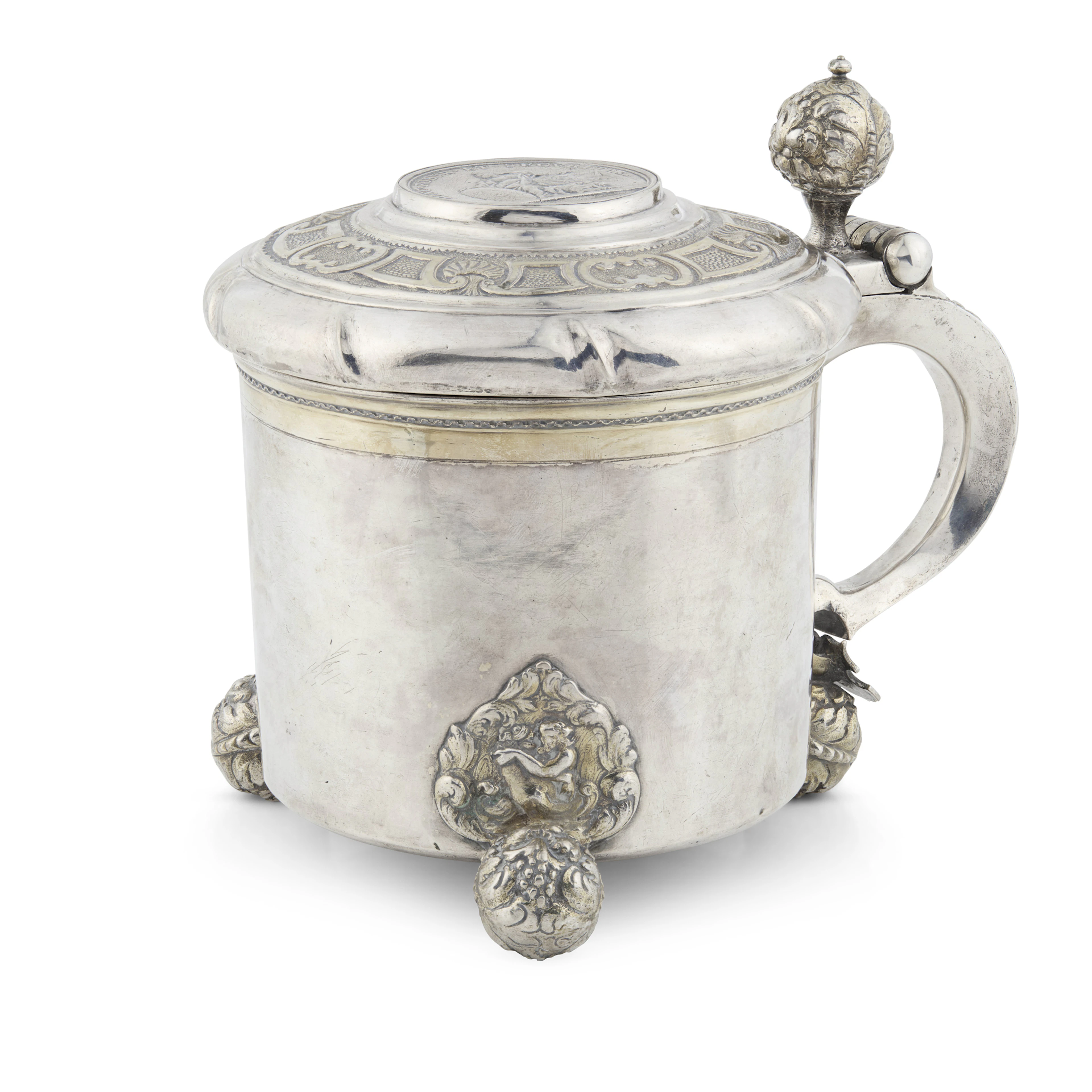 AN EARLY 18TH CENTURY SWEDISH PARCEL-GILT TANKARD