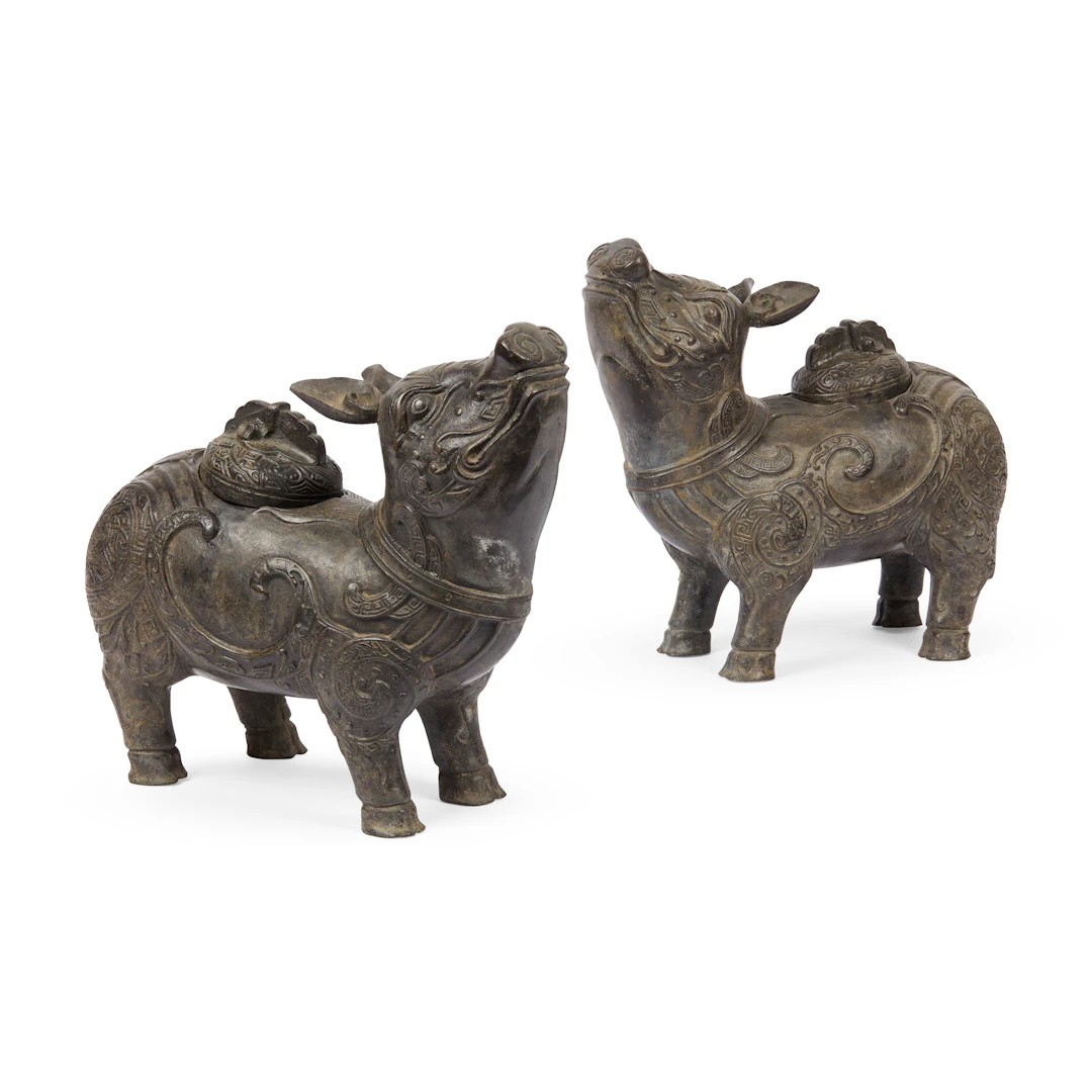 PAIR OF CHINESE ARCHAISTIC BRONZE TAPIR-FORM VESSELS AND COVERS, XIZUN
