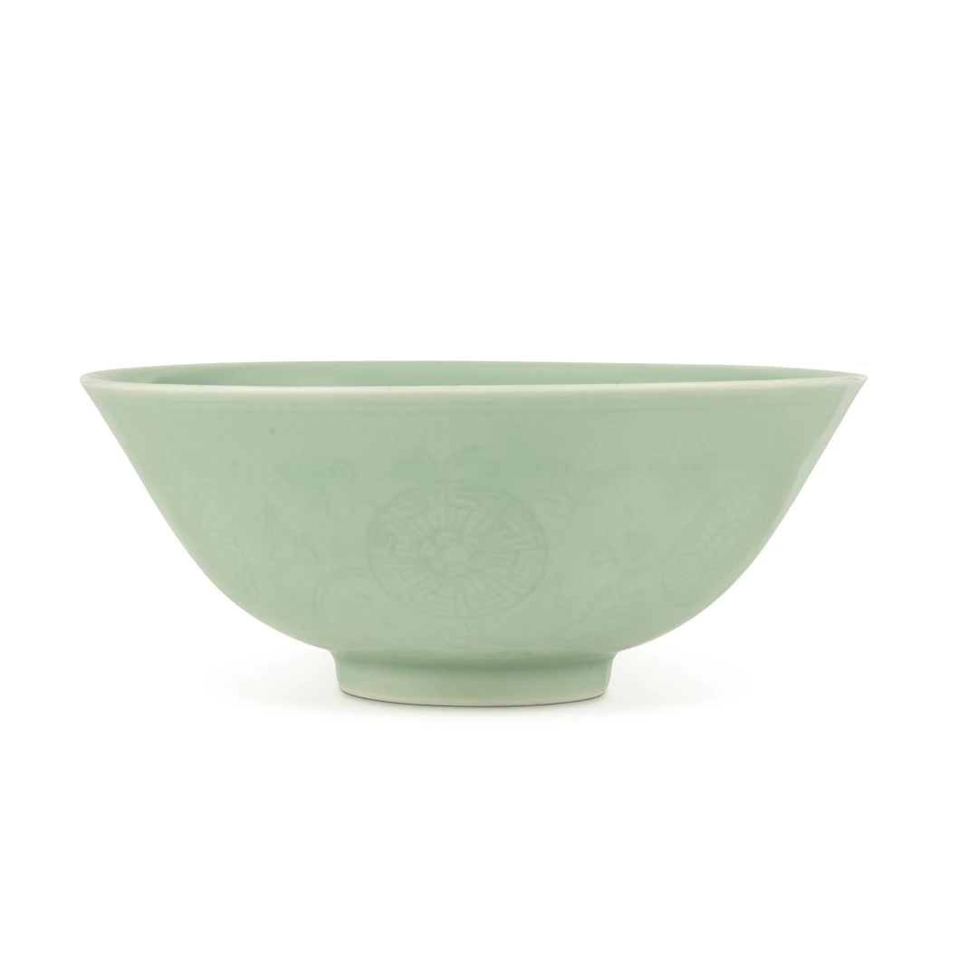 CHINESE CELADON-GLAZED CARVED 'LOTUS SCROLL' BOWL