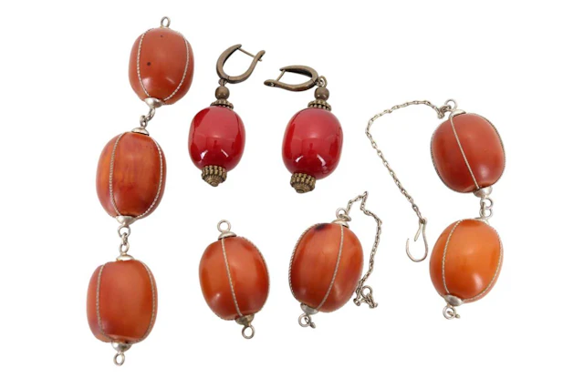 GROUP OF AMBER COLOURED BEADS MID 20TH CENTURY