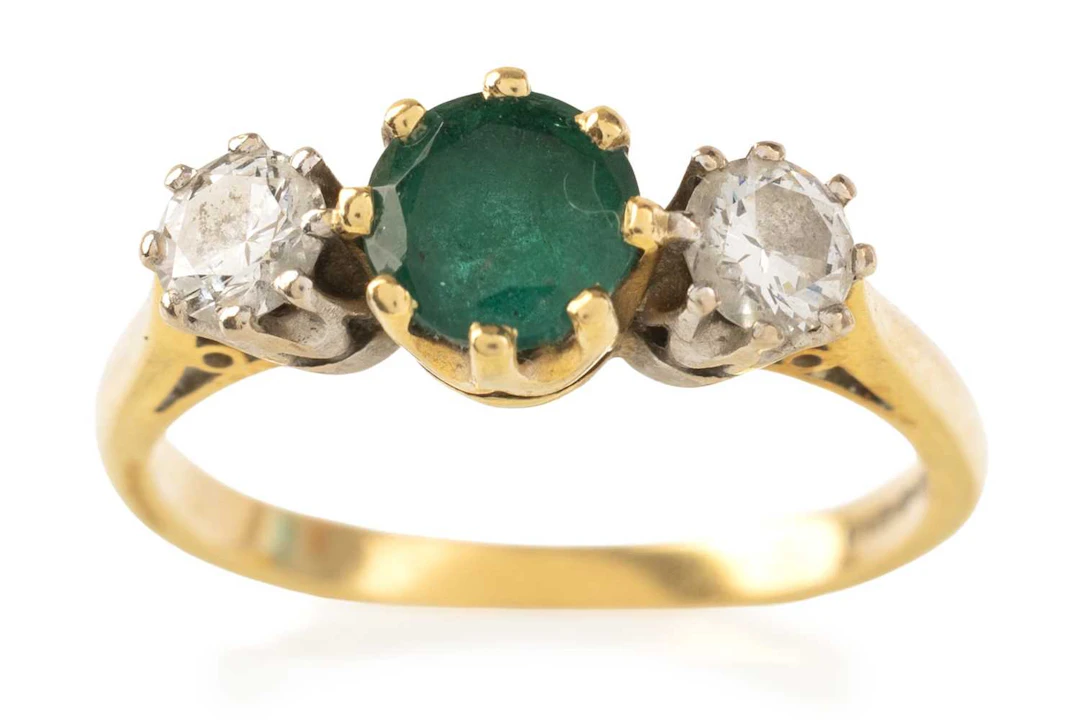 EMERALD AND DIAMOND THREE STONE RING LATE 20TH CENTURY