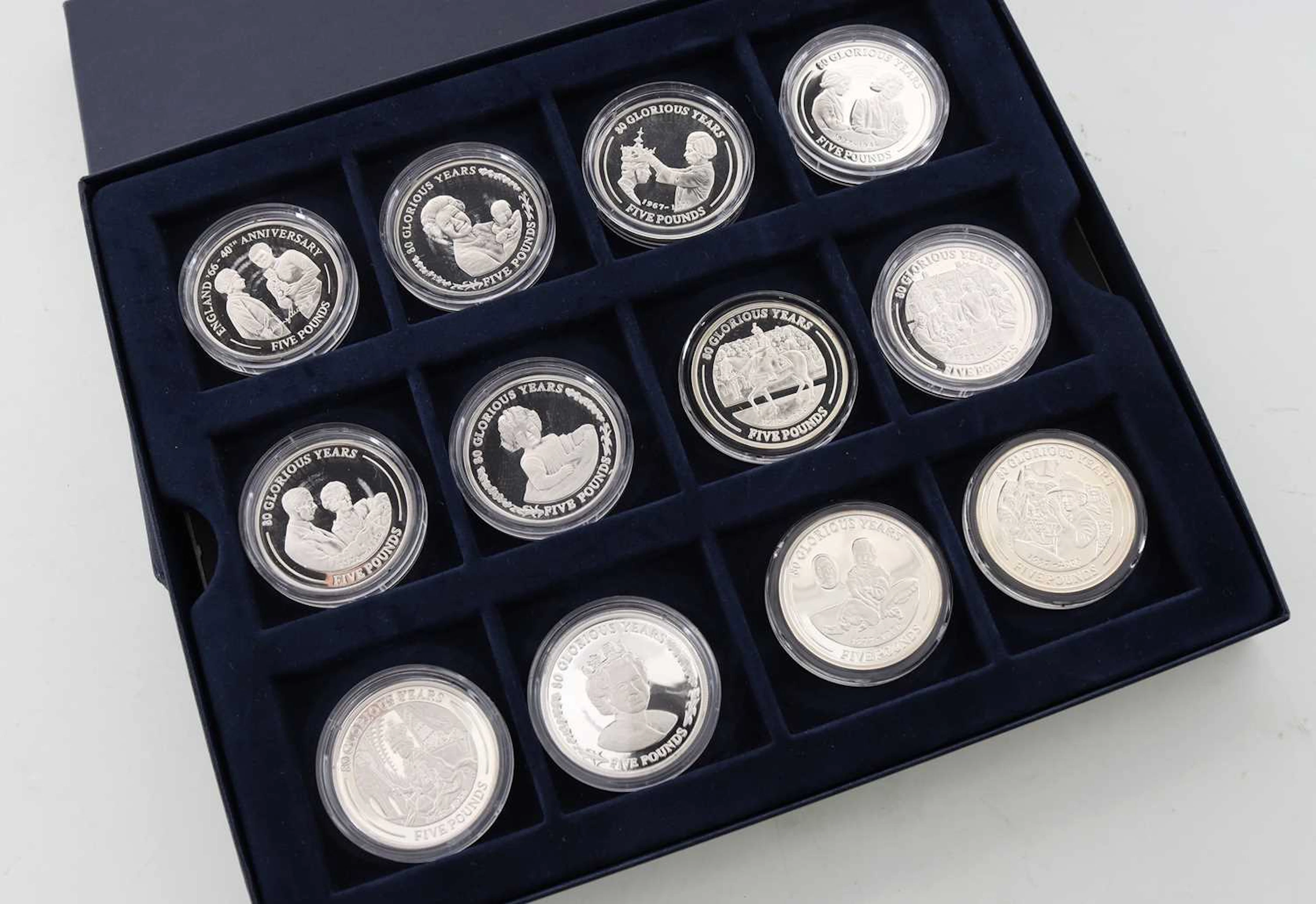 COLLECTION OF TWELVE SILVER COMMEMORATIVE COINS 80 GLORIOUS YEARS 2006